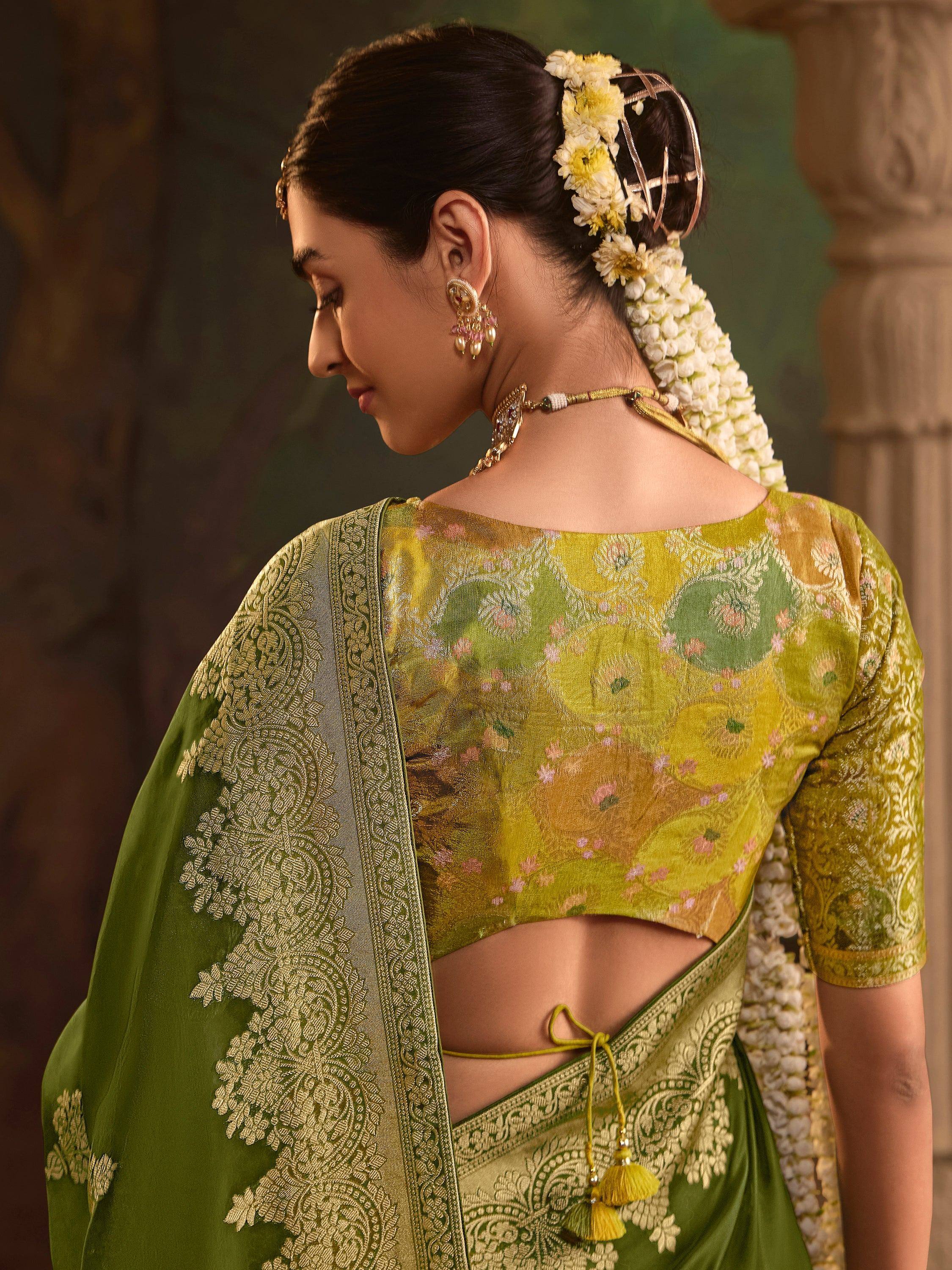 Green floral saree with gold embroidery, back view, floral hair accessory, traditional Indian ethnic wear