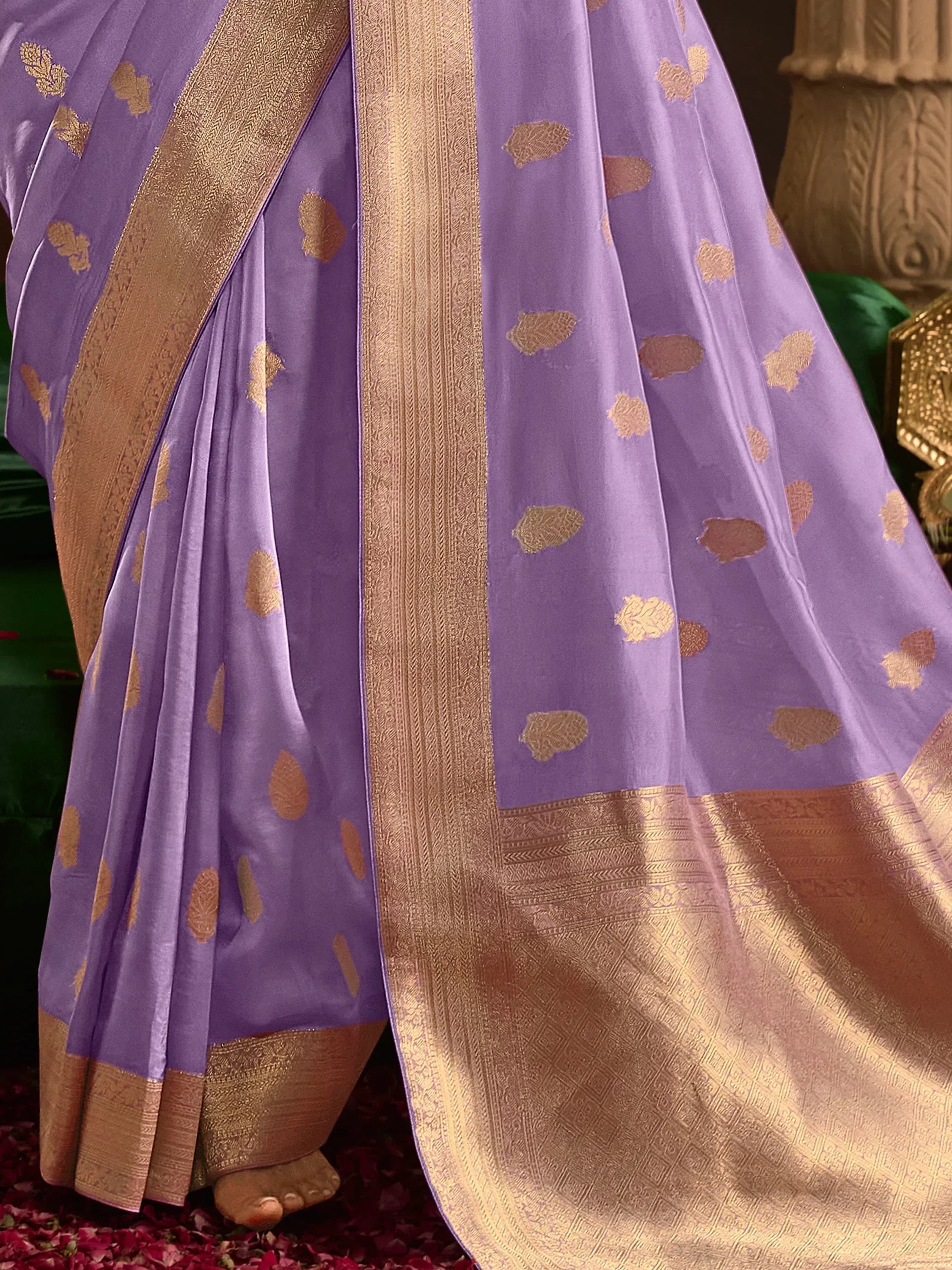Purple saree with gold leaf motifs and intricate border, ideal for ethnic occasions