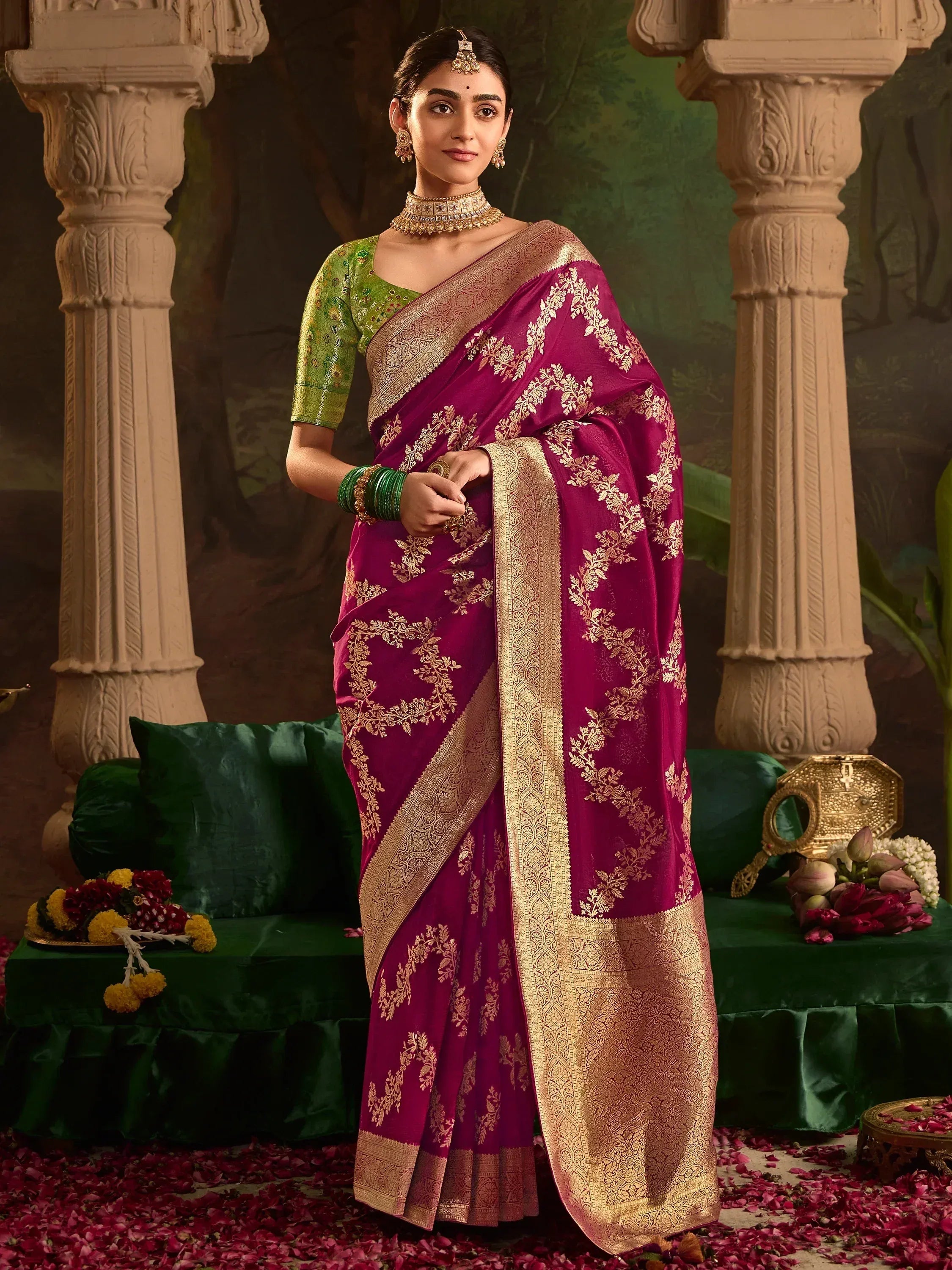 Elegant maroon saree with gold zari work, paired with green blouse, perfect for Indian ethnic occasions.