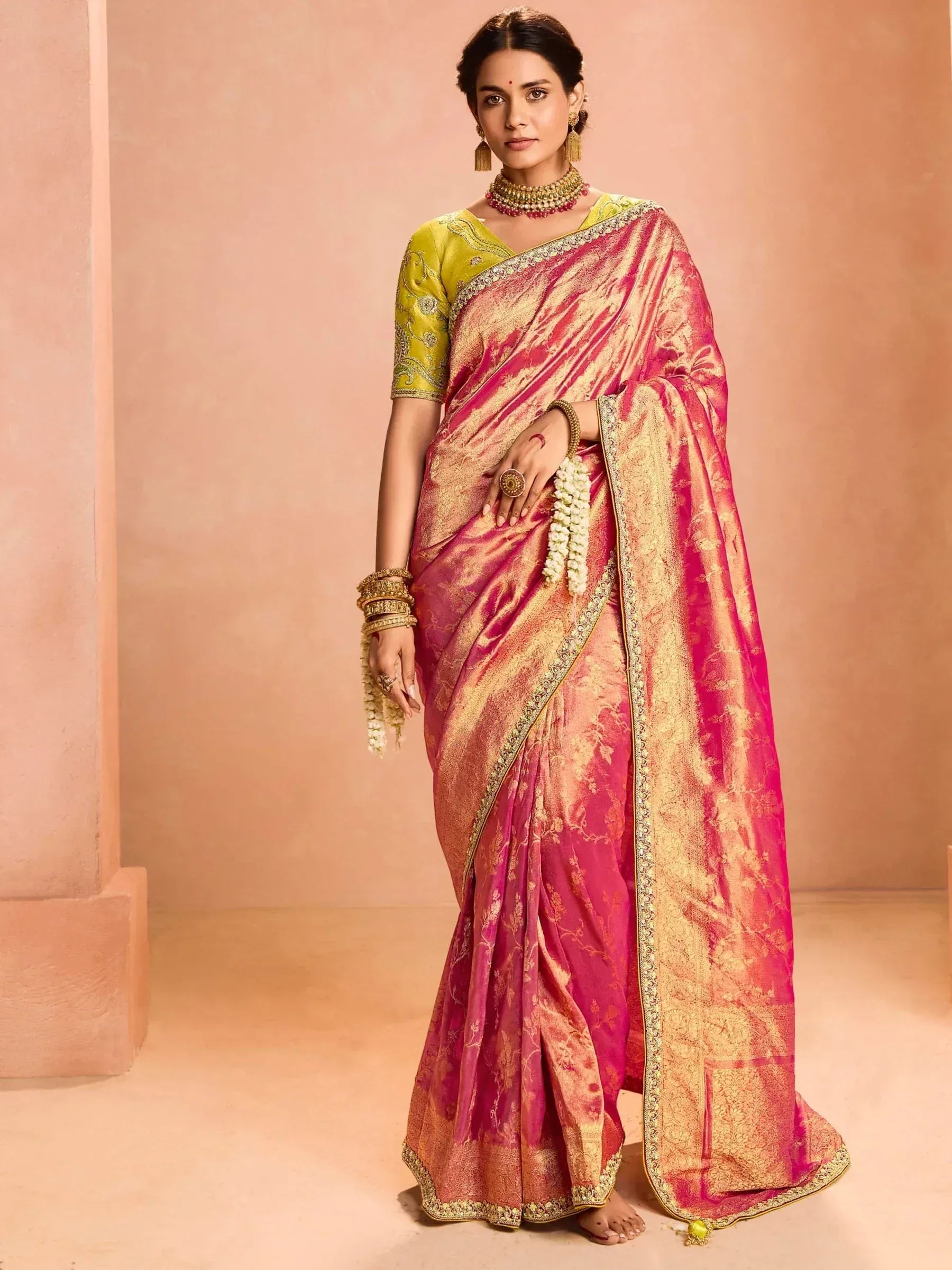 Pink and gold designer saree with green blouse, perfect for Indian ethnic wear occasions