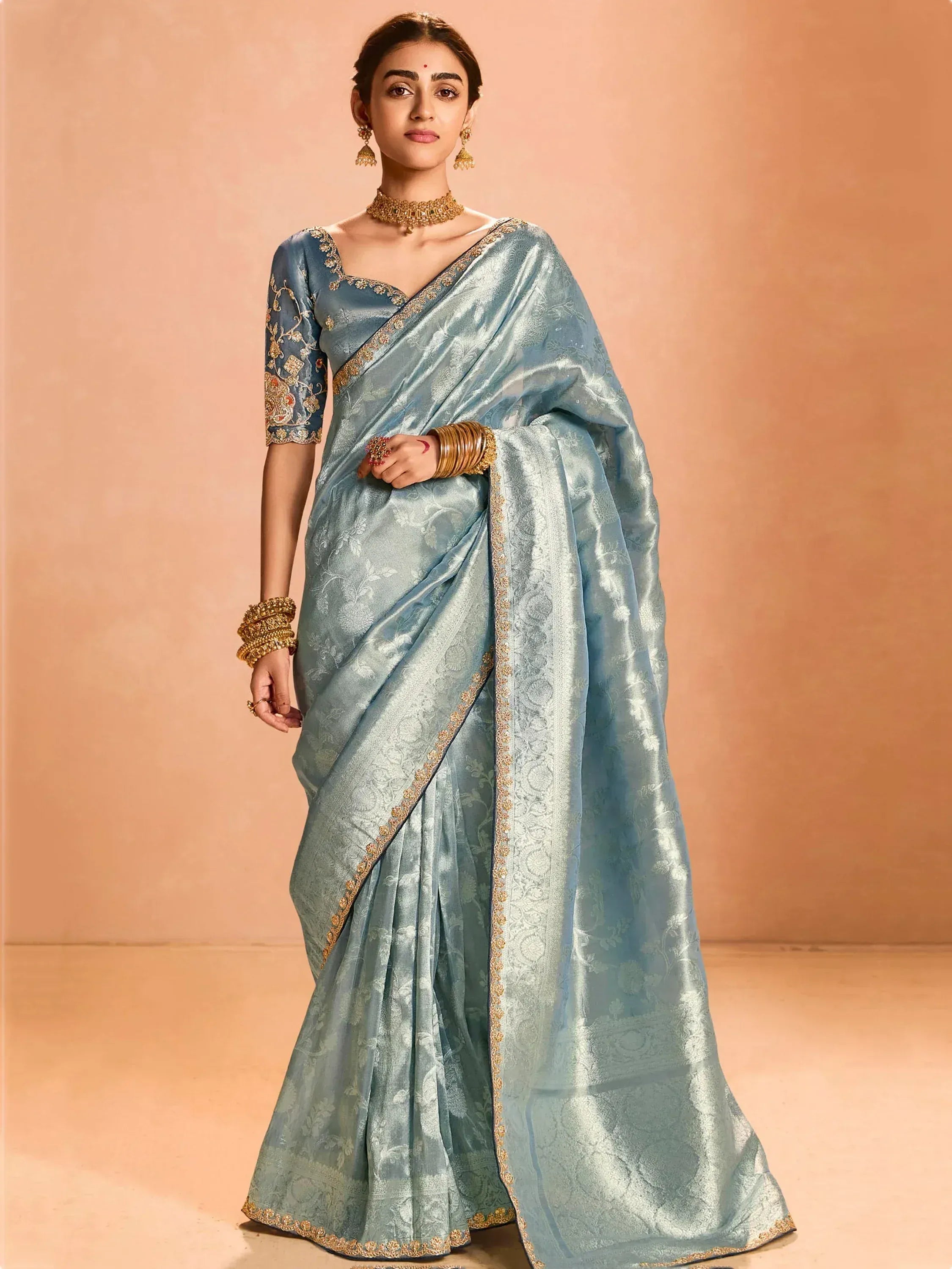 Light blue designer saree with gold embroidery, perfect for Indian ethnic wear occasions