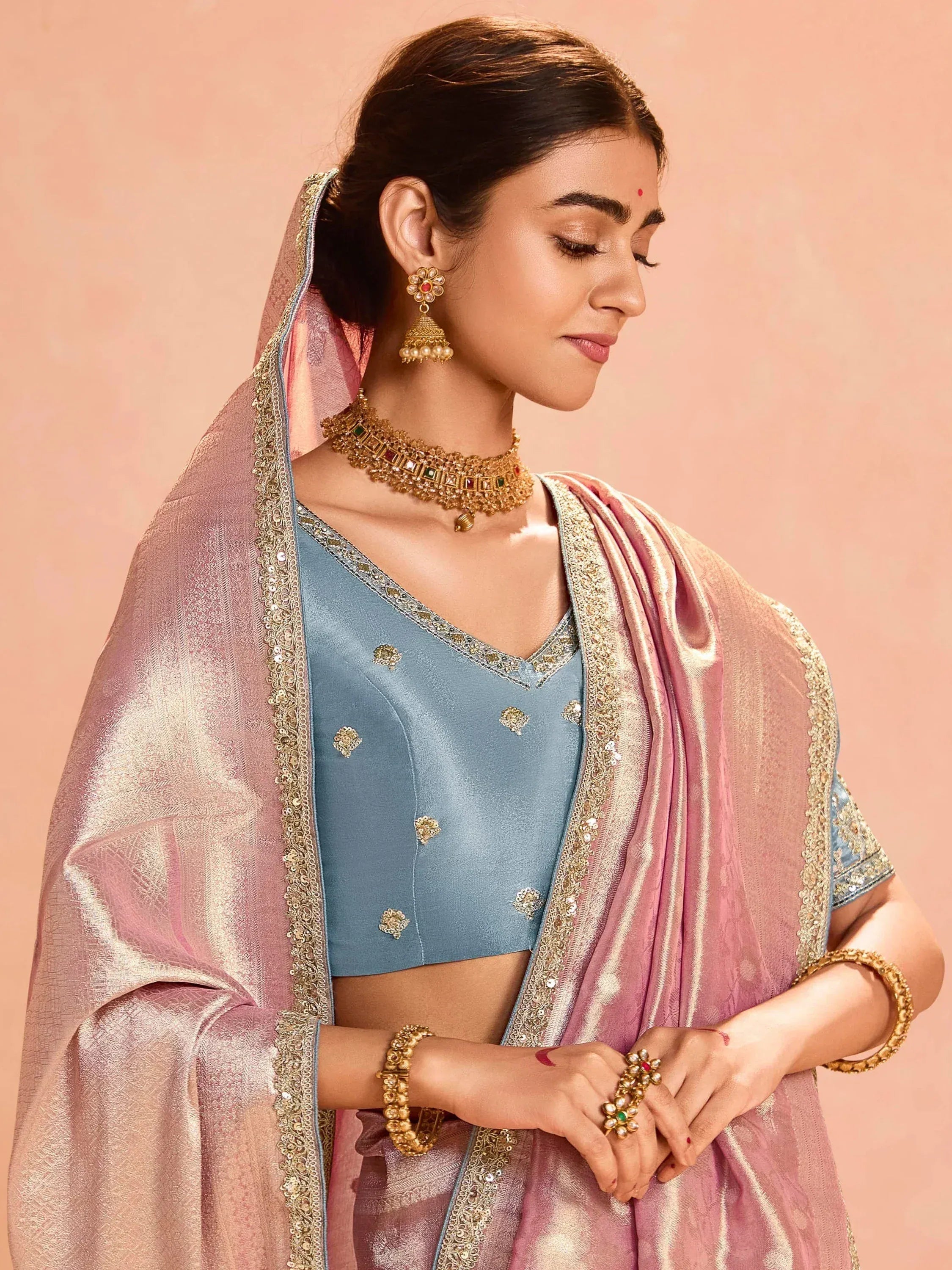 Elegant blue blouse with gold embroidery paired with pink dupatta, traditional Indian ethnic wear