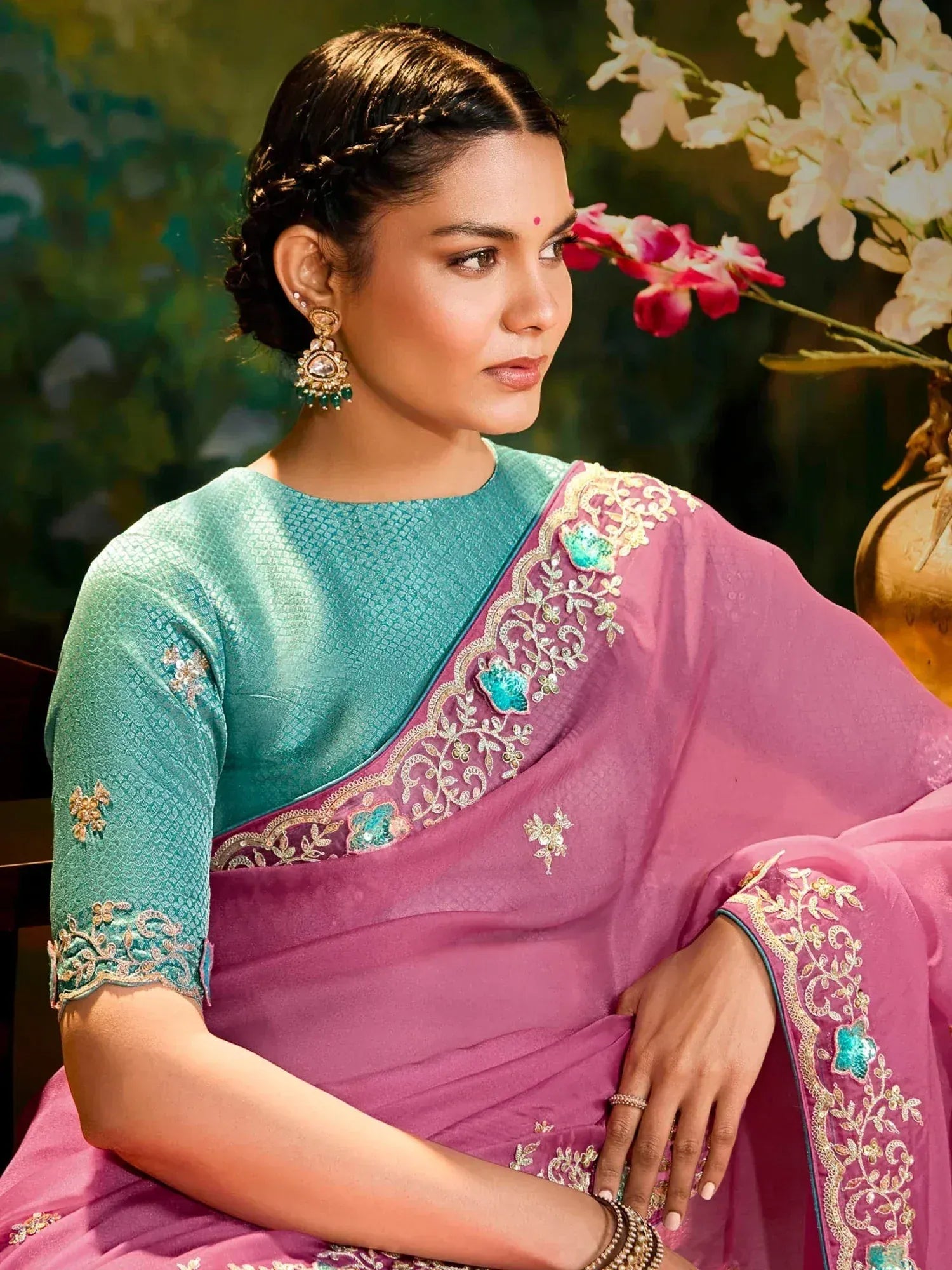 Elegant pink and teal embroidered saree with gold detailing, perfect for Indian ethnic occasions