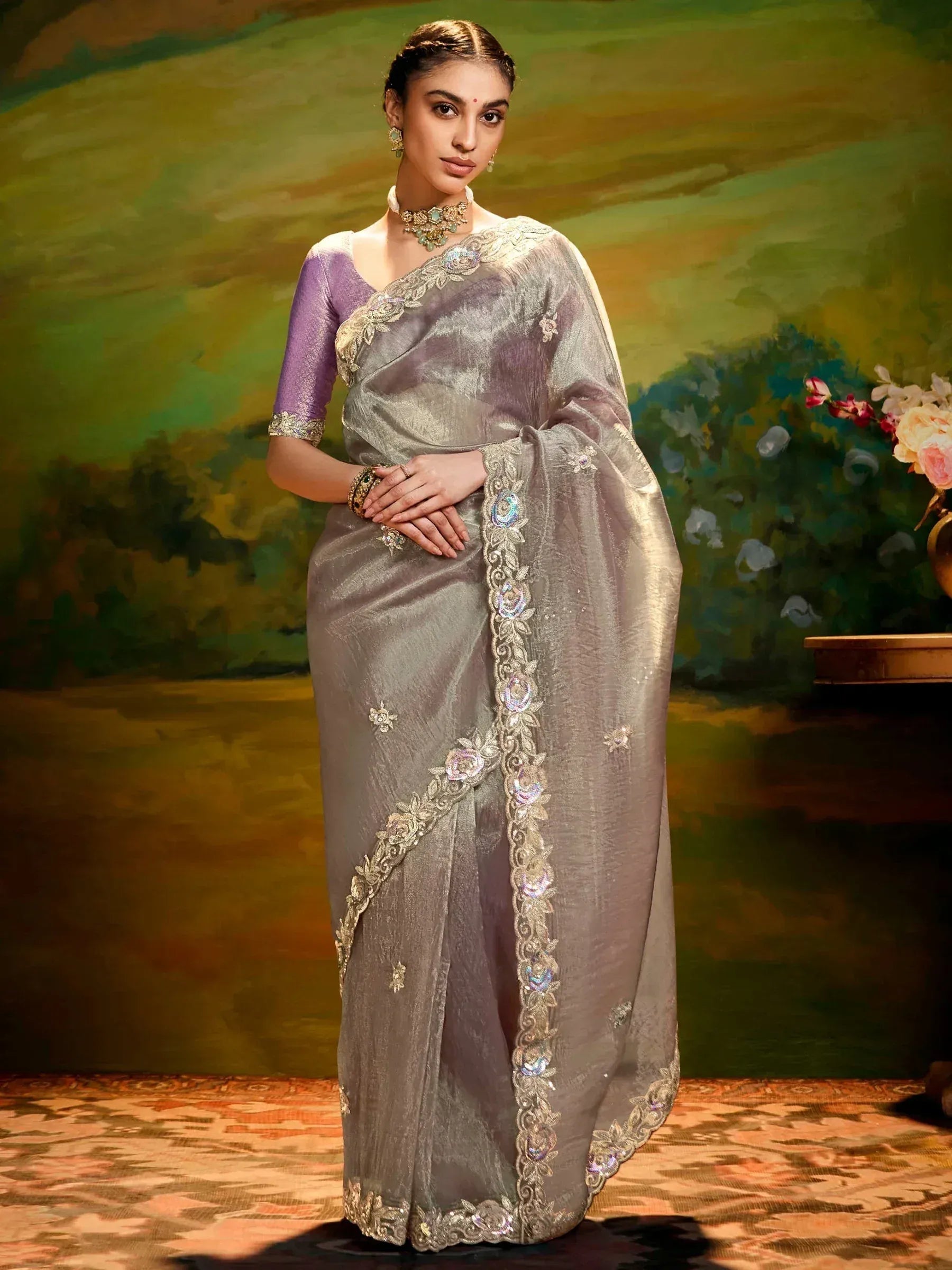 Elegant grey saree with gold floral embroidery and purple blouse, perfect for Indian ethnic occasions.