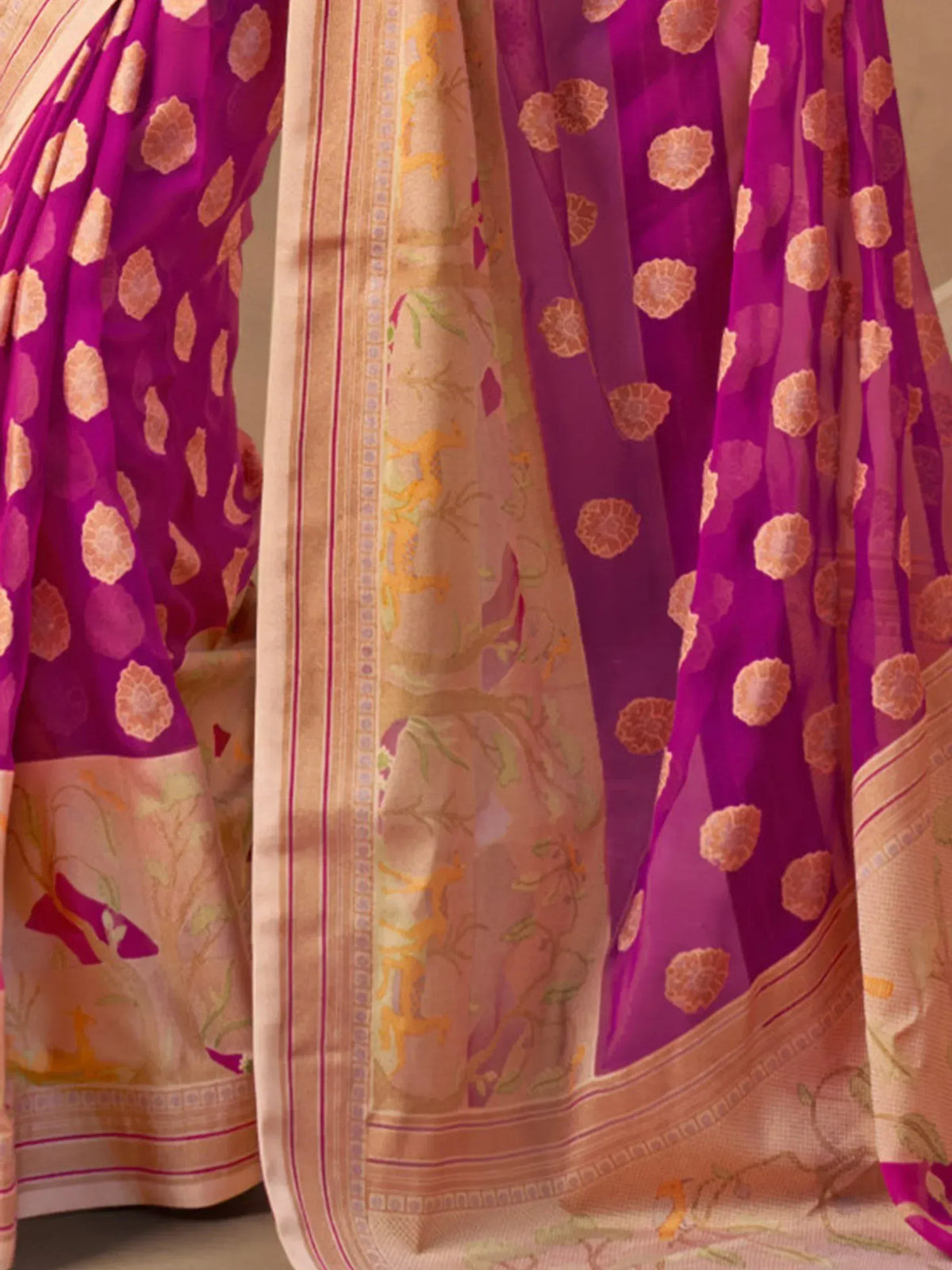 Purple floral saree with golden deer motifs and intricate border design, ethnic Indian wear