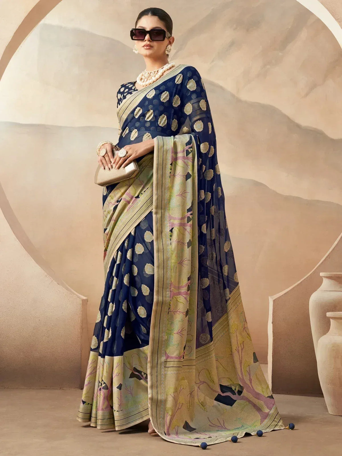Elegant navy blue and cream printed saree with floral motifs, perfect for Indian ethnic wear occasions.