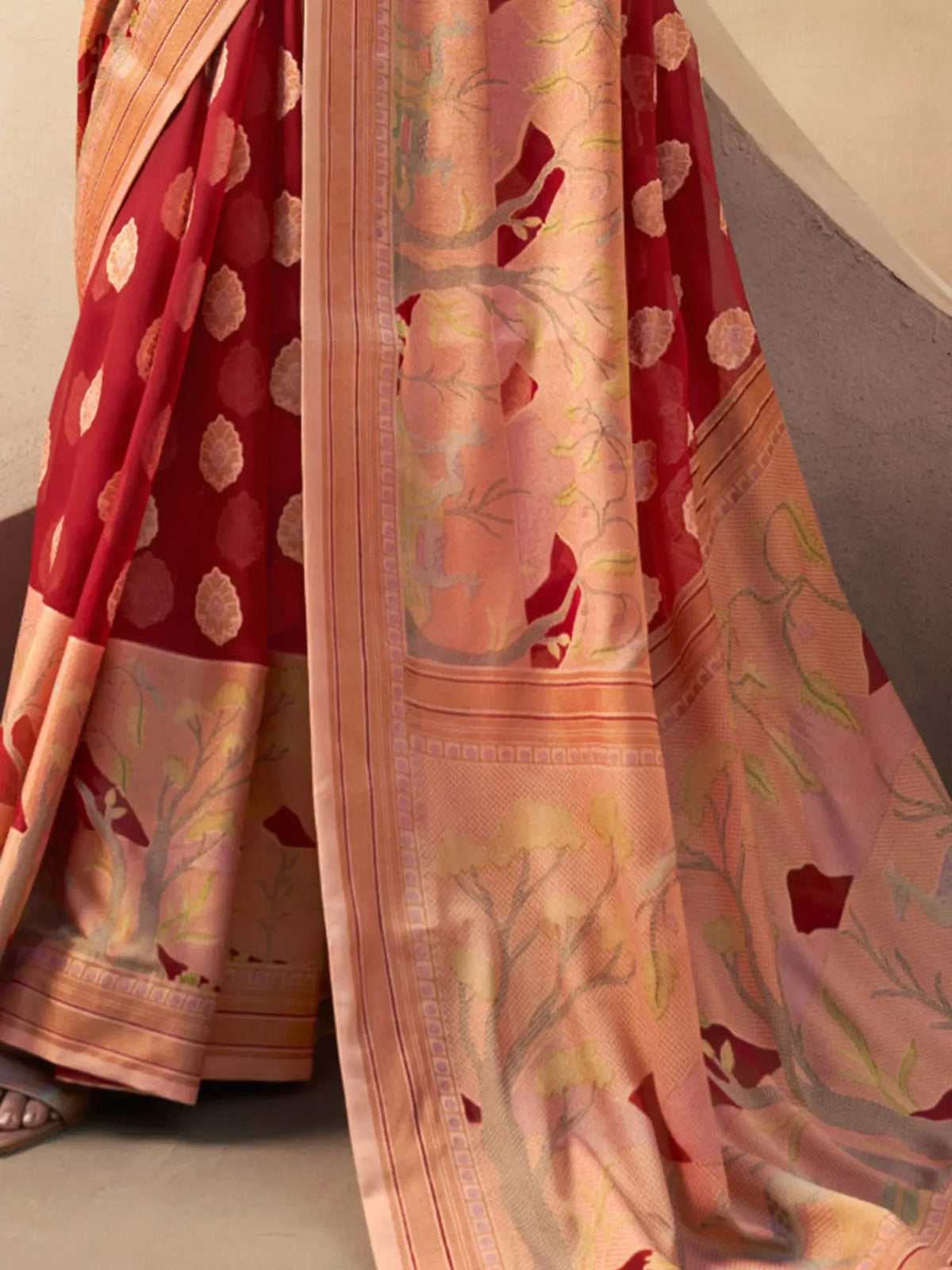 Red and peach floral printed saree with tree motifs, perfect for ethnic wear occasions