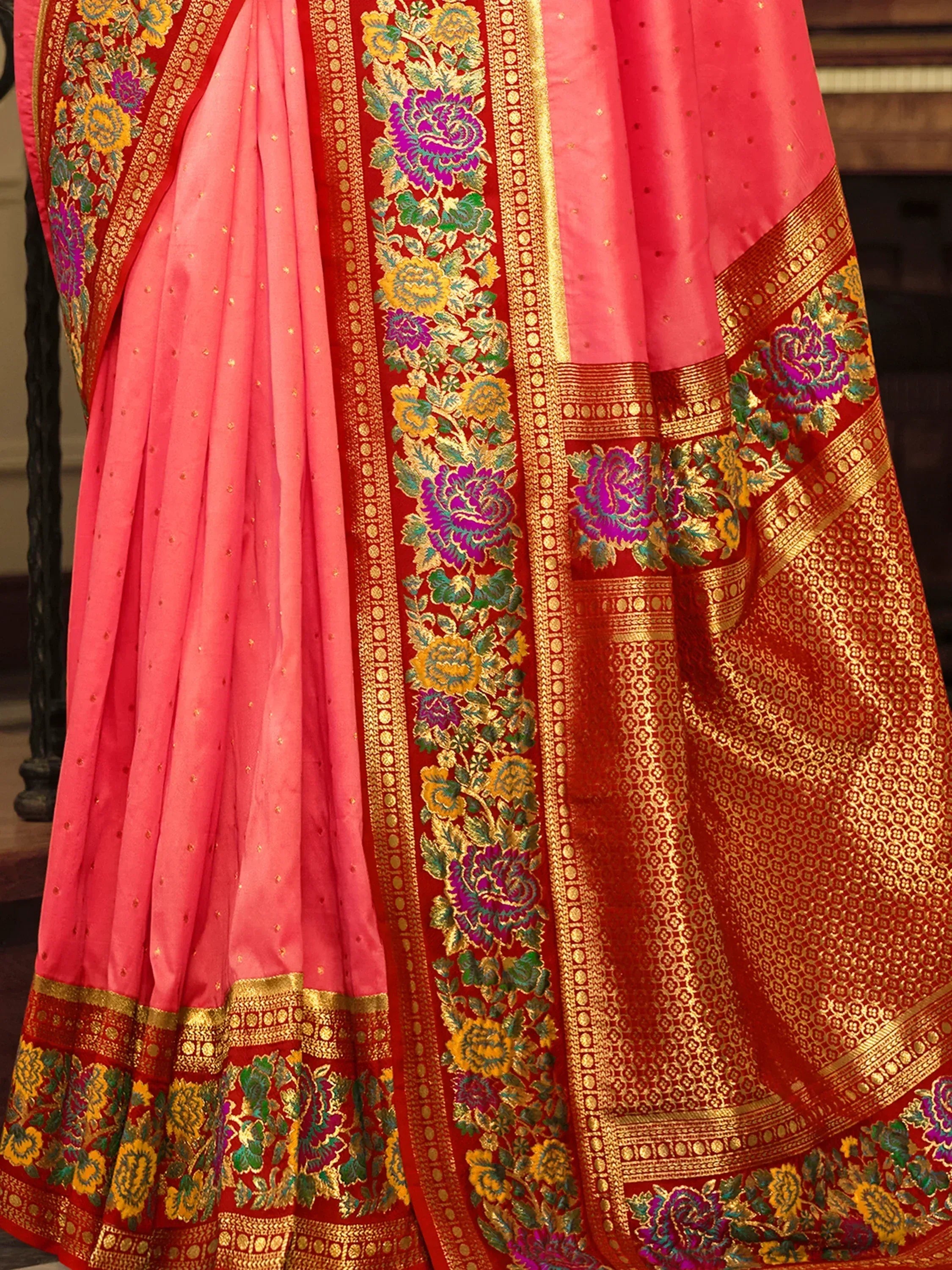Pink and red designer saree with floral zari border, perfect for Indian ethnic wear occasions