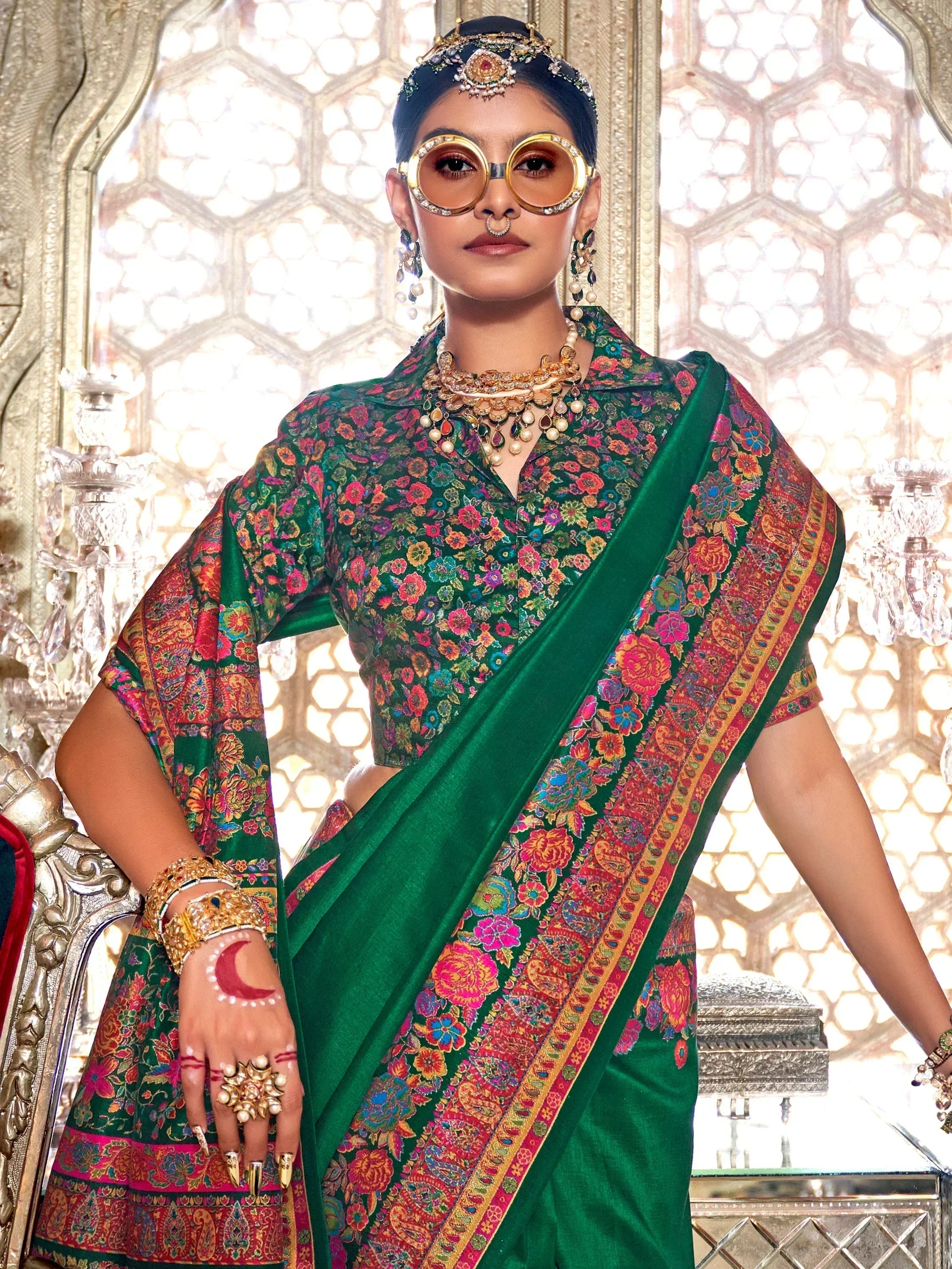 Green floral saree with designer blouse, ethnic jewelry, and traditional Indian accessories for festive occasions.