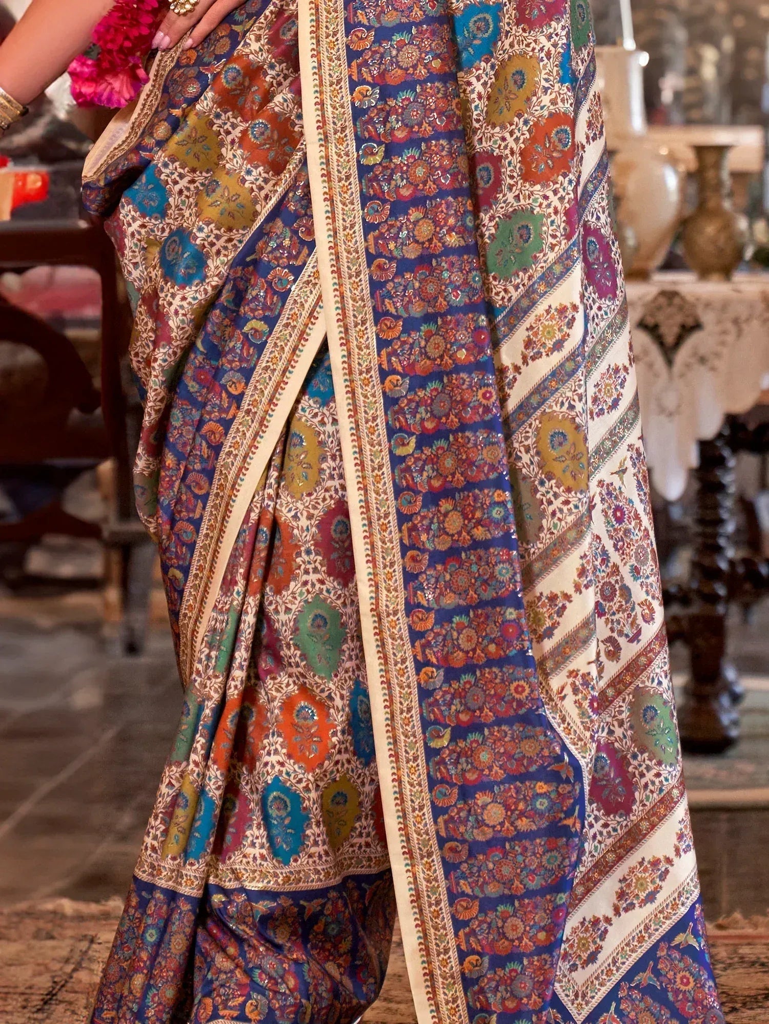 Vibrant floral print saree with intricate border, perfect for ethnic occasions and Indian wear.