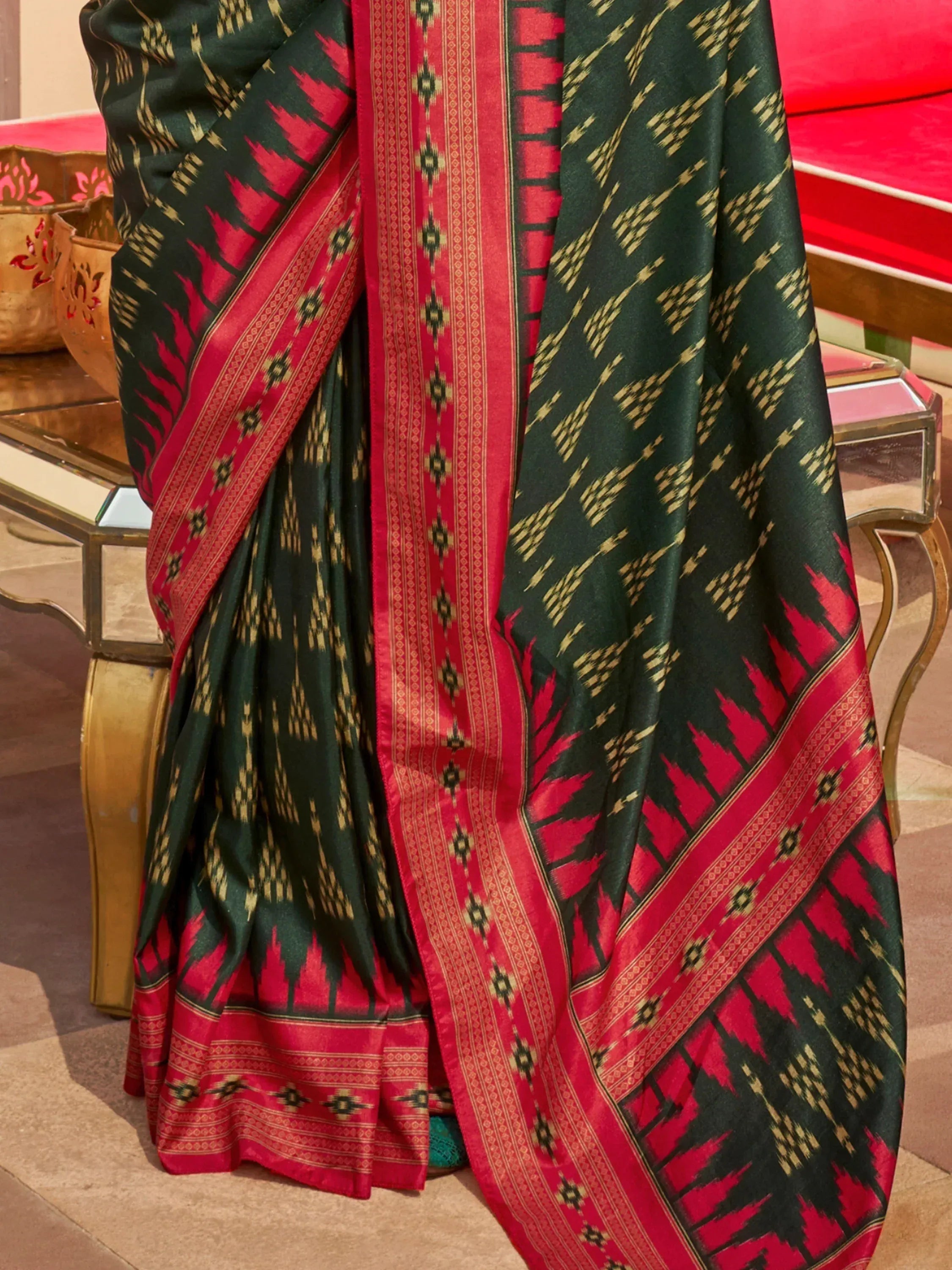 Green and red ikat patterned saree with gold motifs, ethnic Indian wear