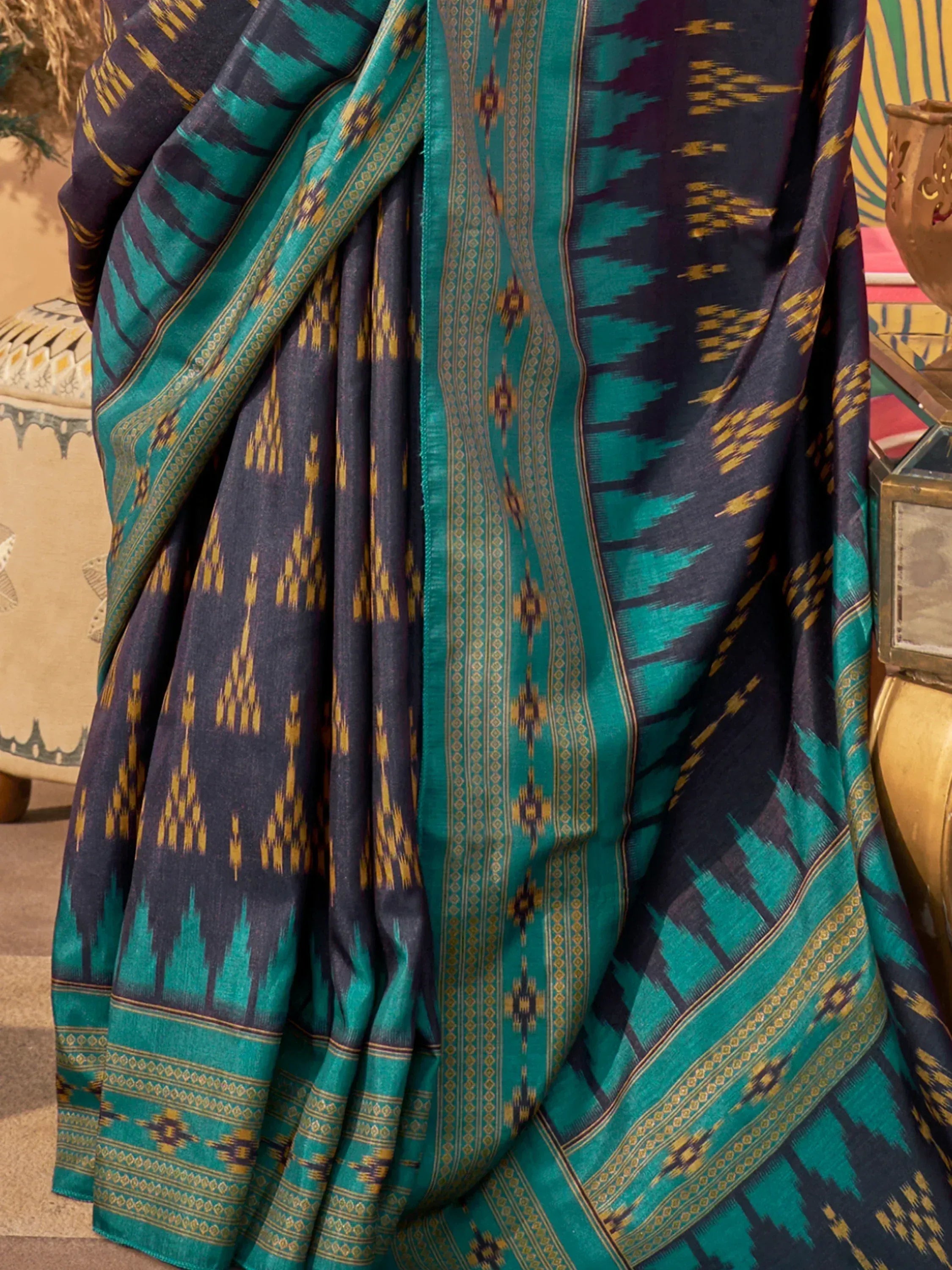 Teal and navy ikat saree with gold geometric patterns, ethnic Indian wear