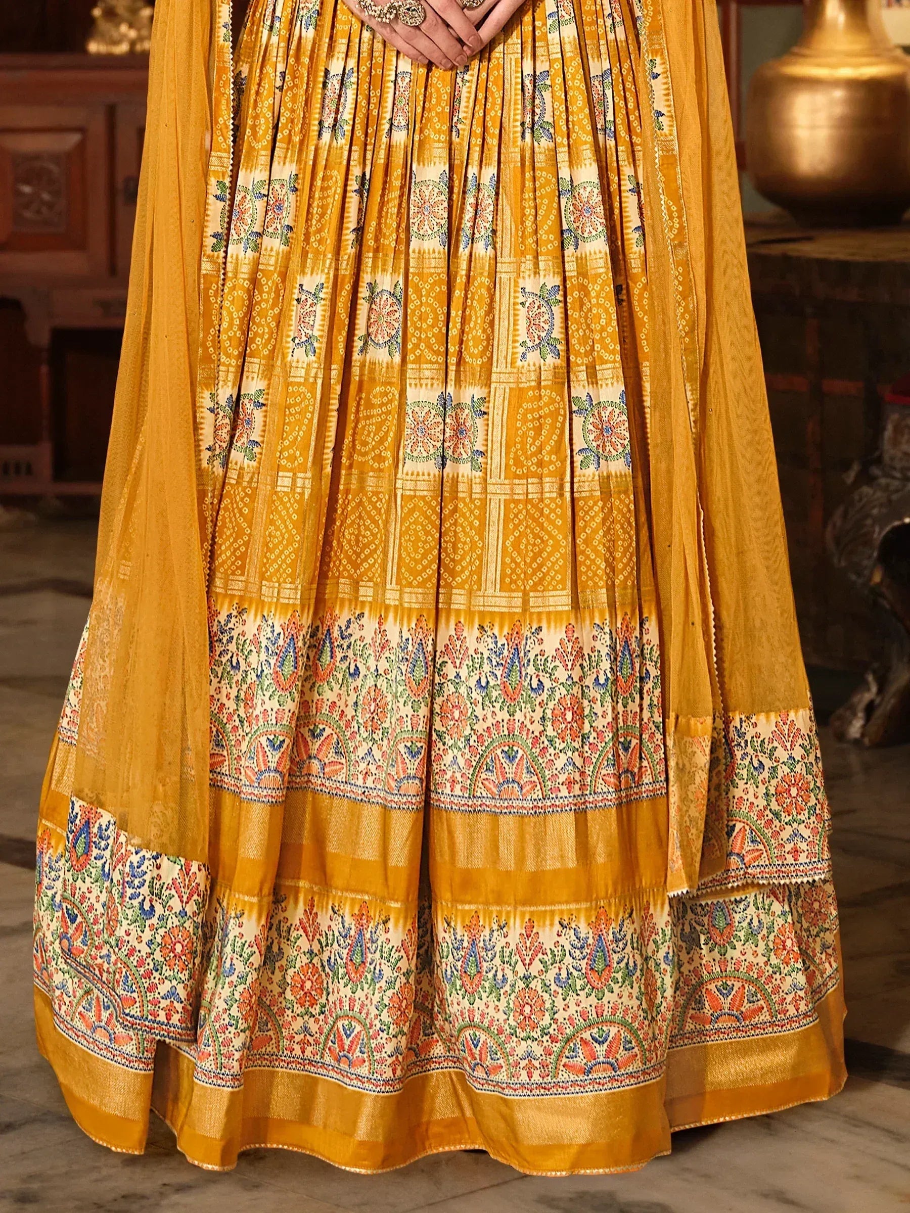 Yellow printed lehenga with floral and geometric patterns, ethnic Indian wear