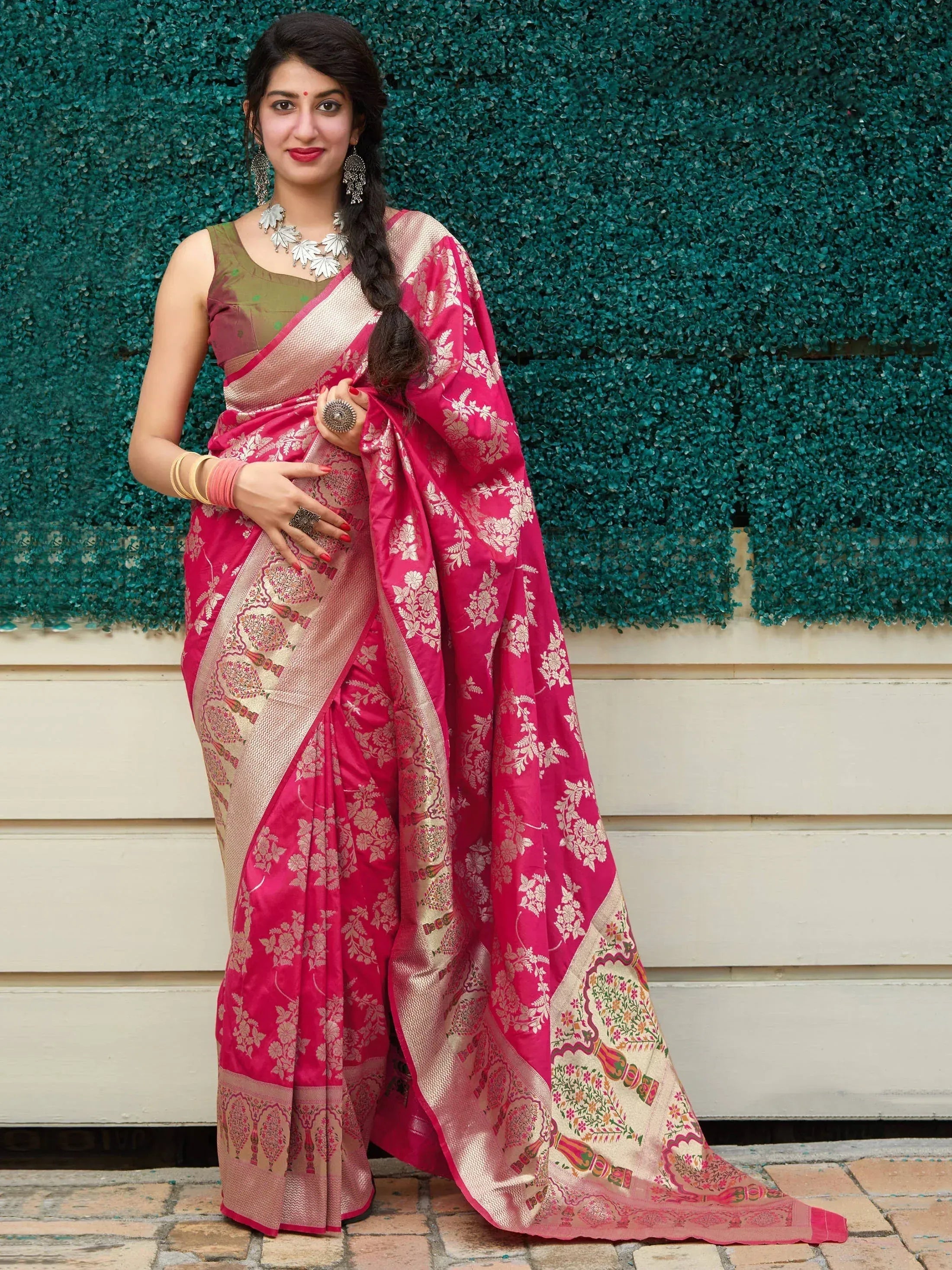 Pink floral silk saree with gold zari border, paired with olive green blouse, perfect for Indian ethnic occasions
