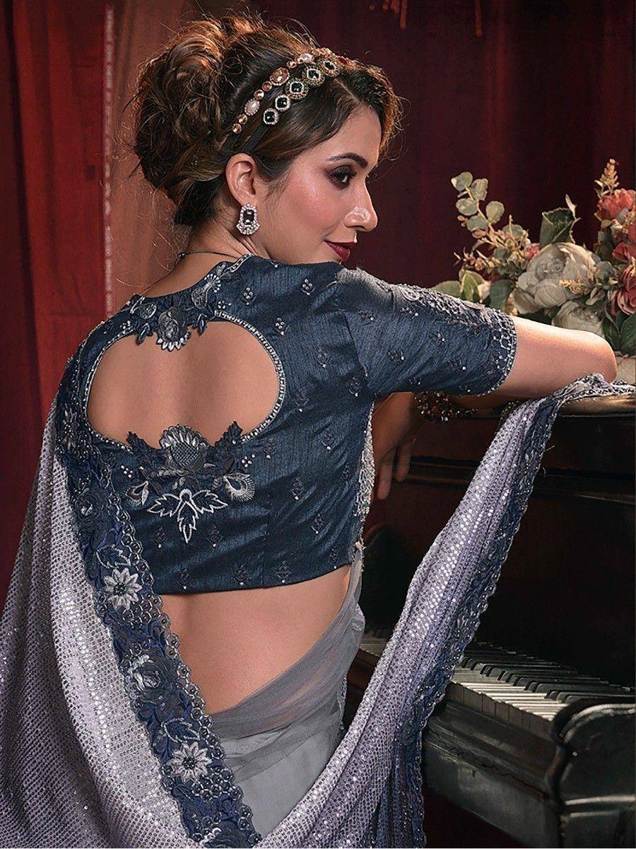 Elegant navy blue designer blouse with back cutout, floral embroidery, and sequin saree for Indian ethnic wear