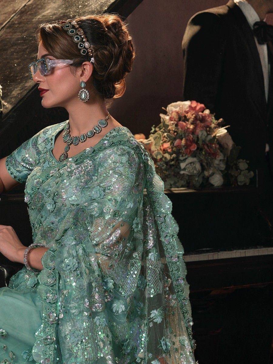 Elegant mint green designer saree with sequin embroidery, perfect for Indian ethnic wear events.