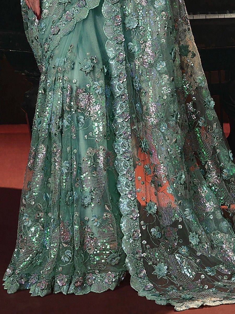 Emerald green designer lehenga with floral sequin embroidery and sheer overlay