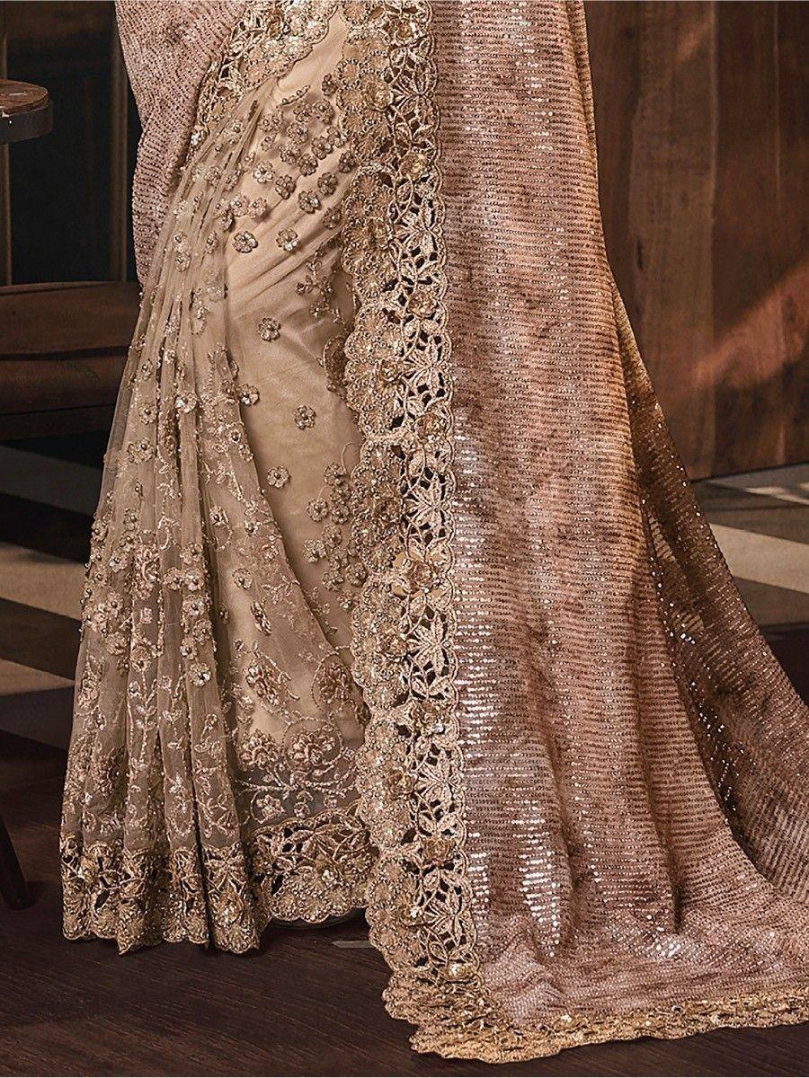 Elegant gold embroidered saree with sequin border, perfect for Indian ethnic wear occasions