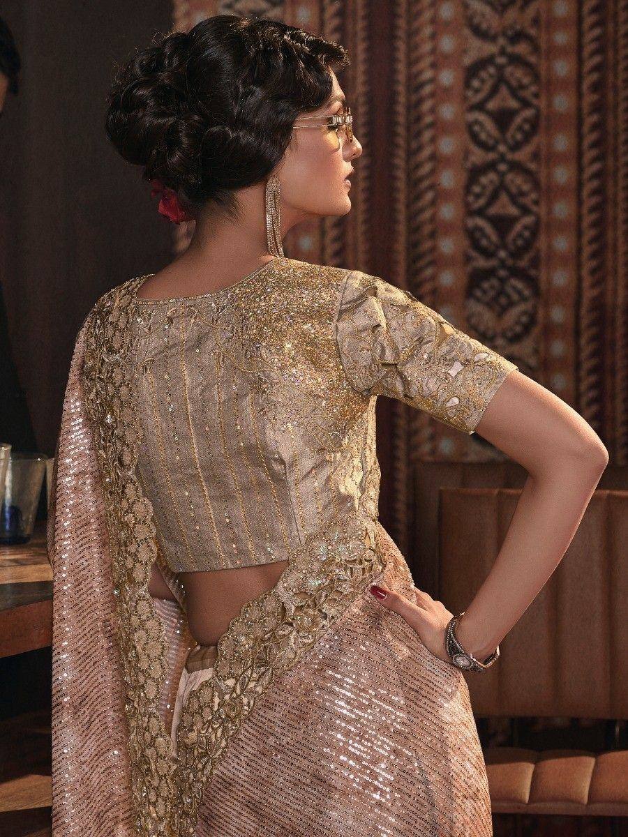 Elegant gold sequin lehenga choli with back cutout, perfect for Indian ethnic wear events