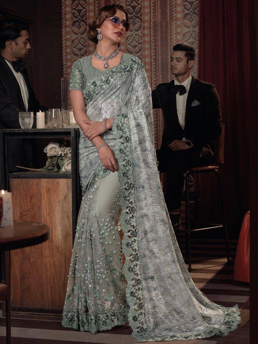Elegant mint green designer saree with sequin embroidery, perfect for Indian ethnic events and weddings.