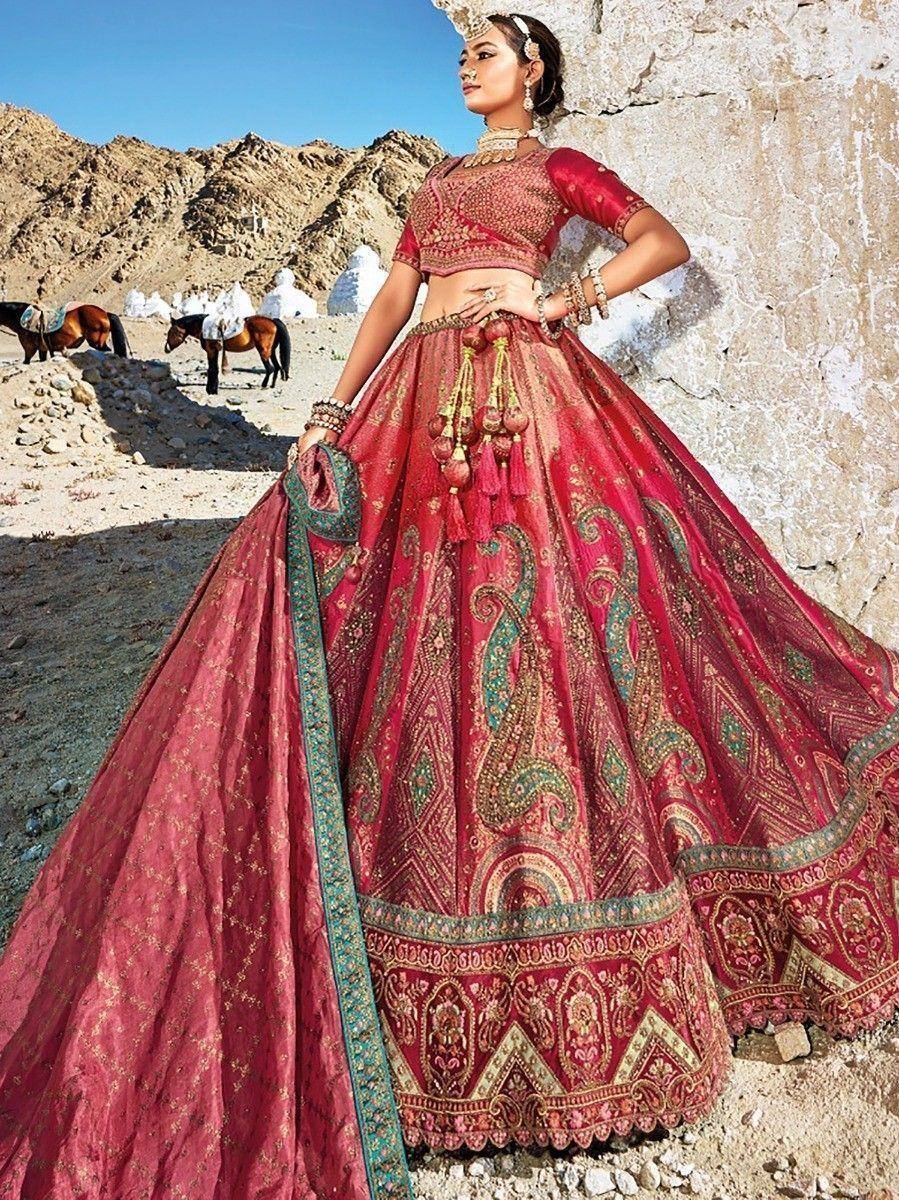 Red embroidered lehenga choli with gold paisley design, perfect for Indian weddings and festive occasions