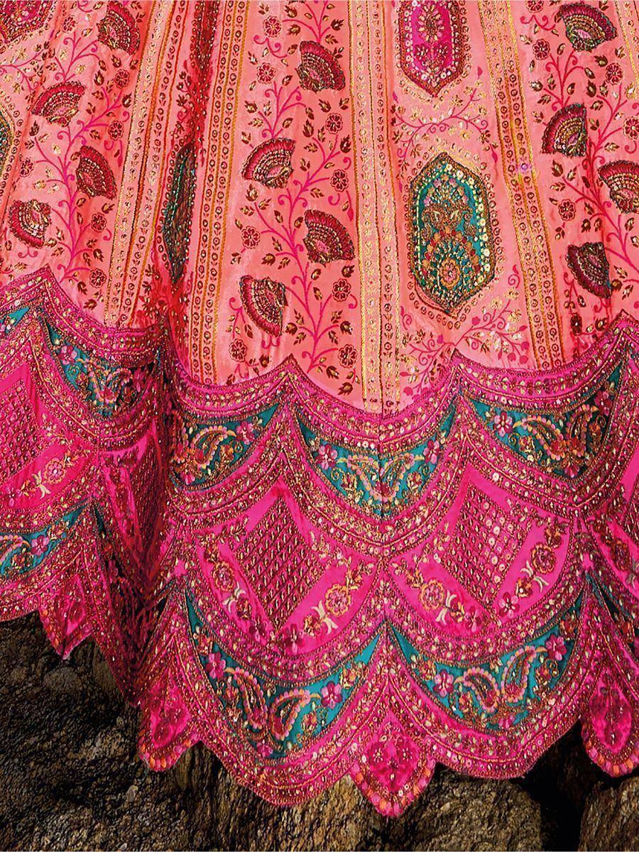 Pink embroidered lehenga with intricate floral and paisley designs, perfect for Indian ethnic wear.