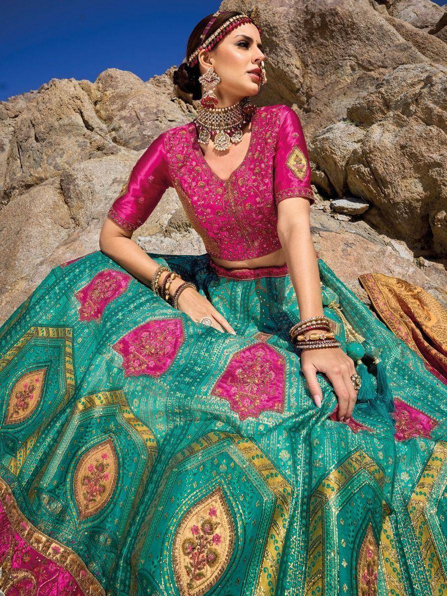Pink and teal designer lehenga choli with intricate embroidery, perfect for Indian ethnic wear occasions