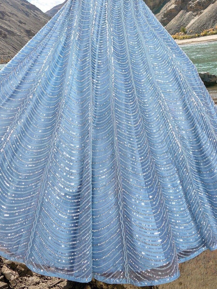 Light blue sequin lehenga skirt with wavy embellishments, perfect for Indian ethnic wear events