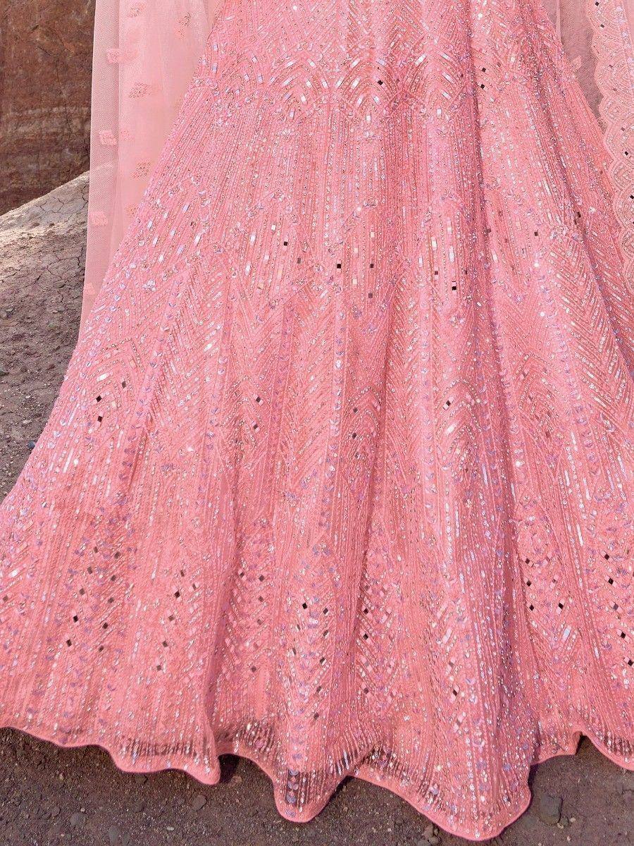 Pink embroidered lehenga with intricate mirror work and sequin detailing, perfect for Indian ethnic wear.