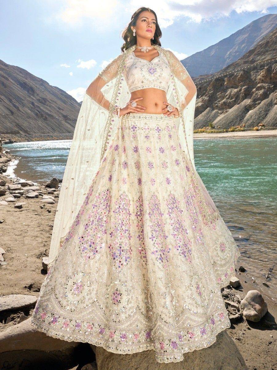 Elegant ivory lehenga choli with floral embroidery, perfect for Indian weddings and festive occasions.