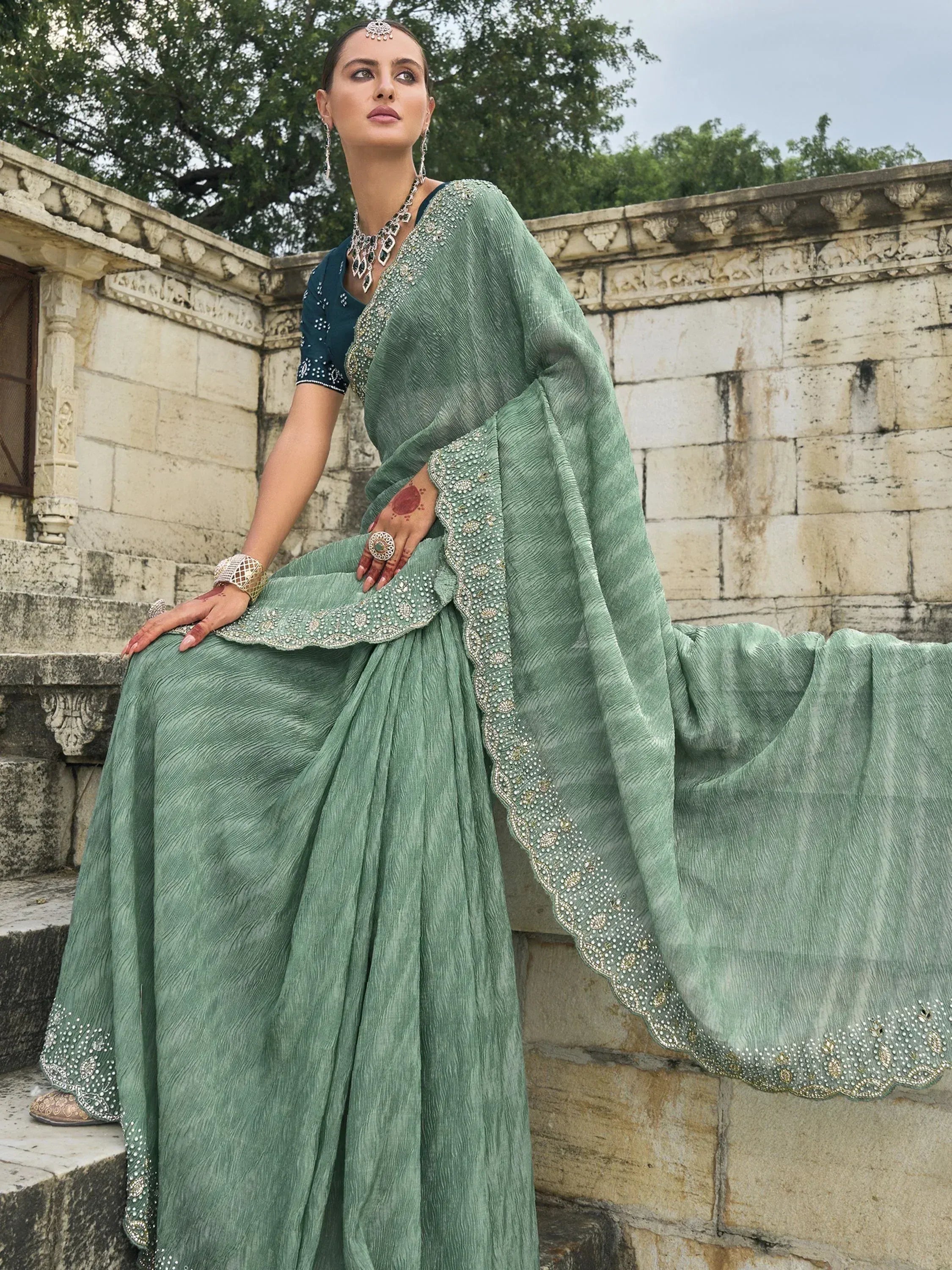 Elegant mint green embroidered saree with designer blouse, perfect for Indian ethnic occasions