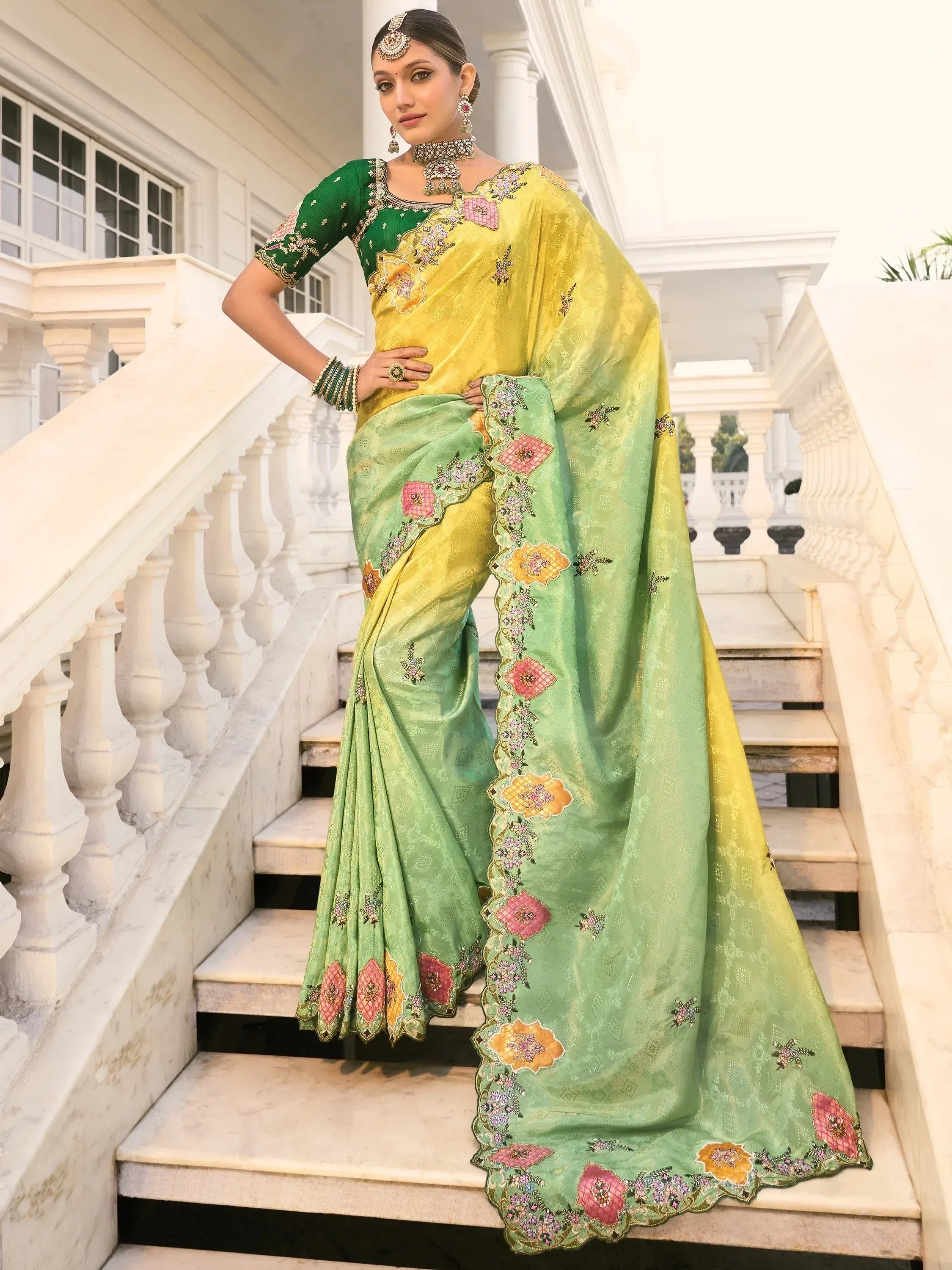 Elegant green and yellow embroidered saree with floral designs, perfect for Indian ethnic wear.