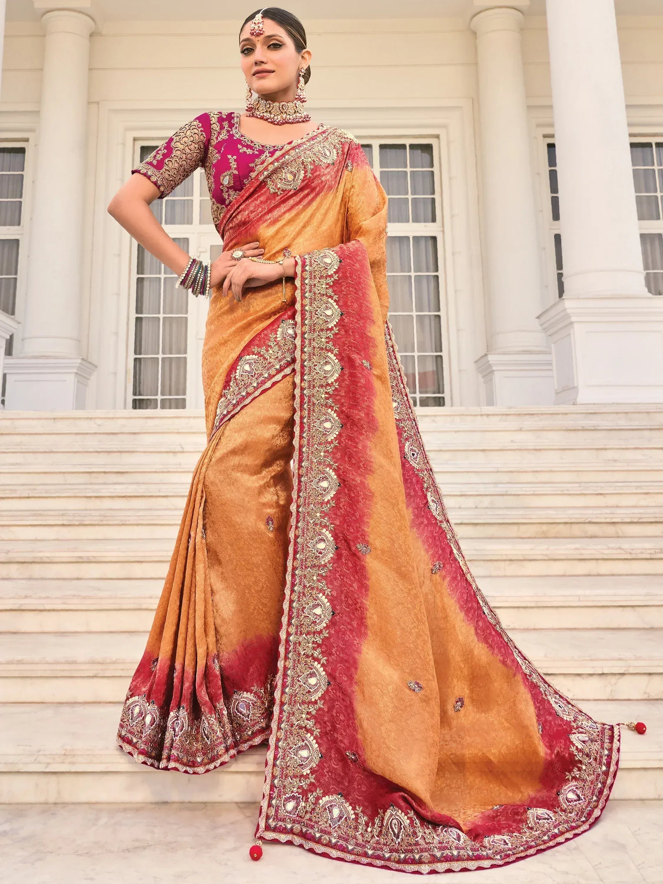 Elegant maroon and gold embroidered saree with designer blouse, perfect for Indian ethnic occasions.