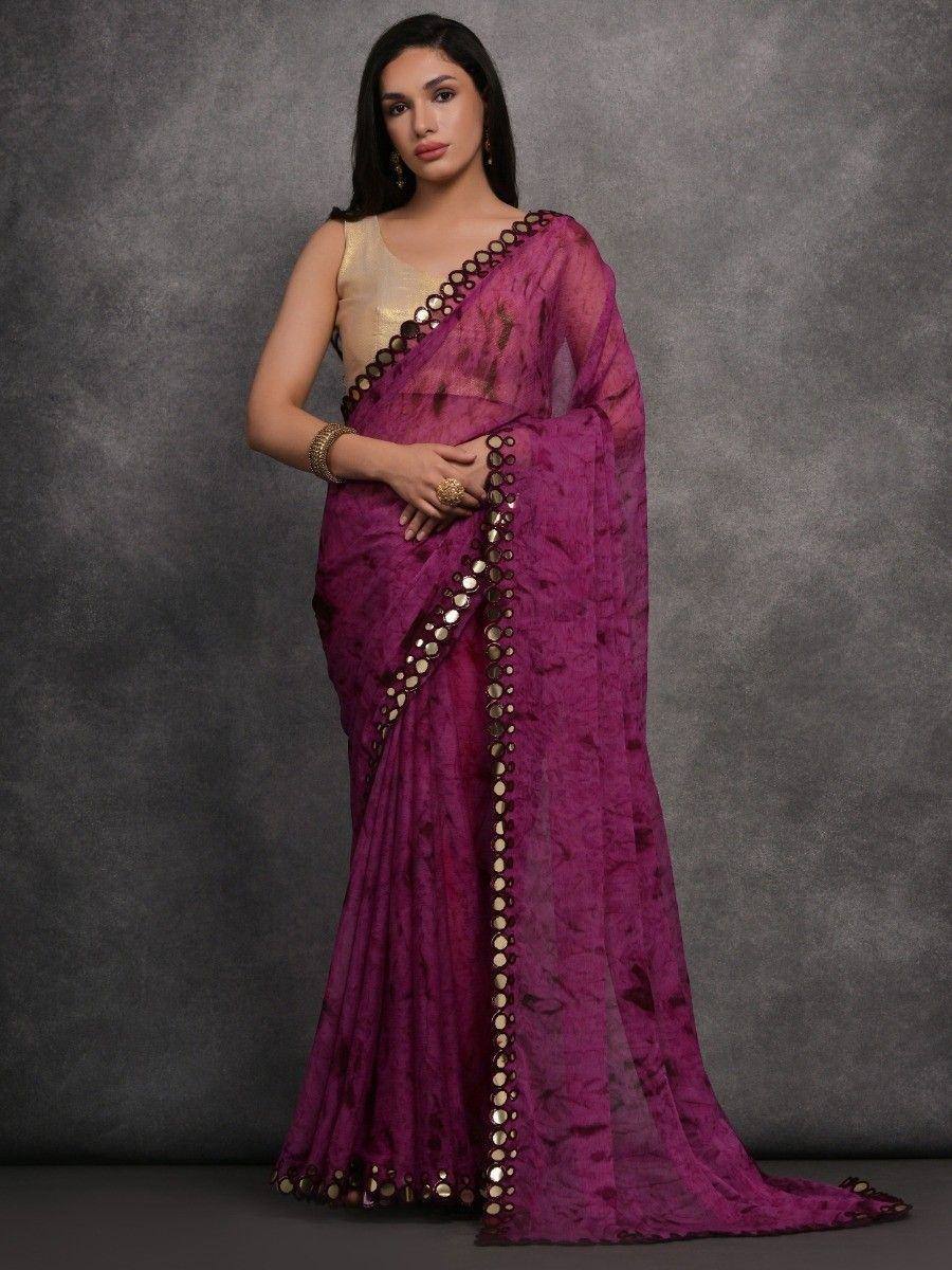 Purple ethnic saree with gold mirror work, paired with golden blouse, perfect for Indian occasions