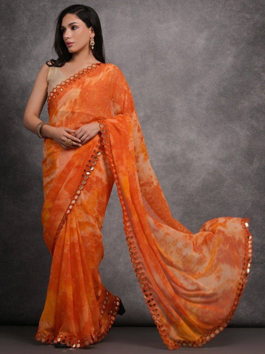 Orange tie-dye saree with mirror work border, stylish Indian ethnic wear for women