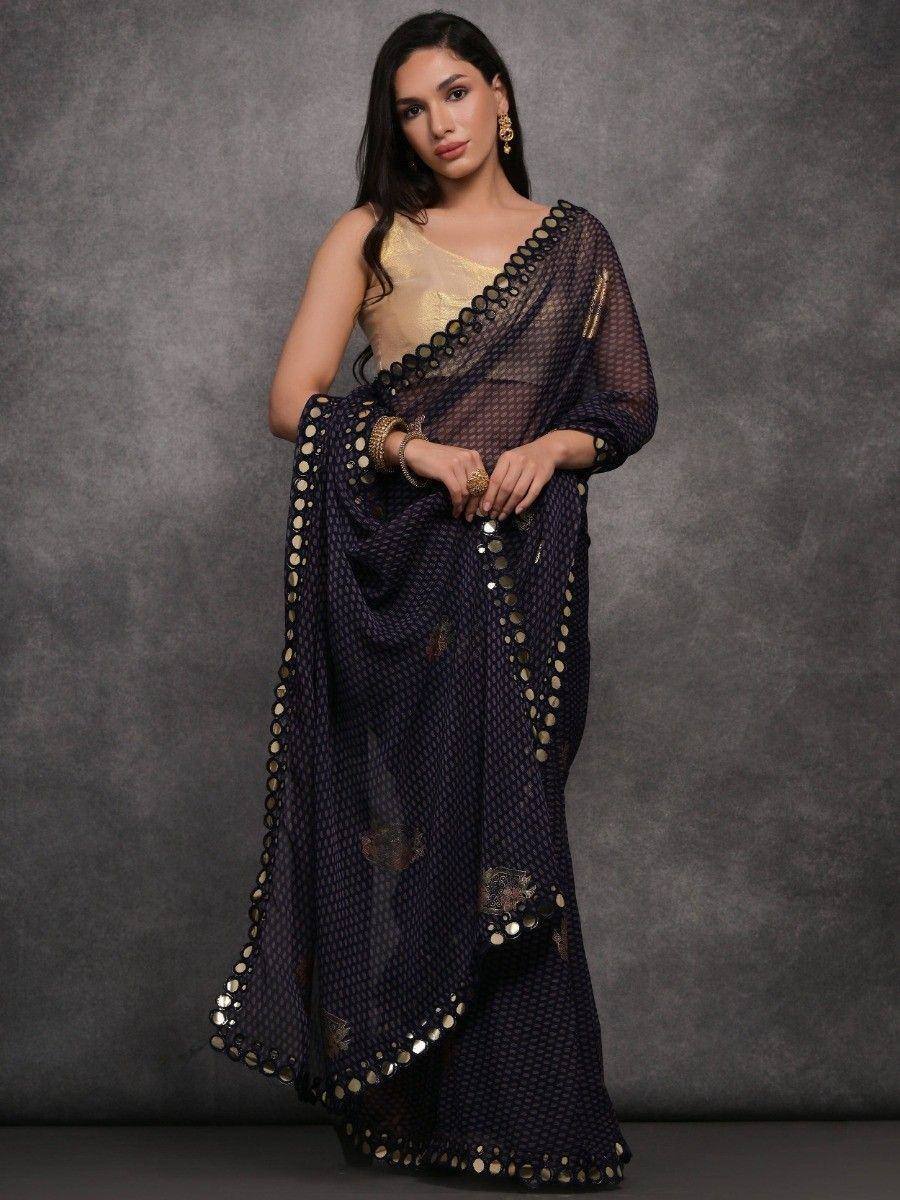 Elegant navy blue saree with gold mirror work and sheer blouse, perfect for Indian ethnic wear