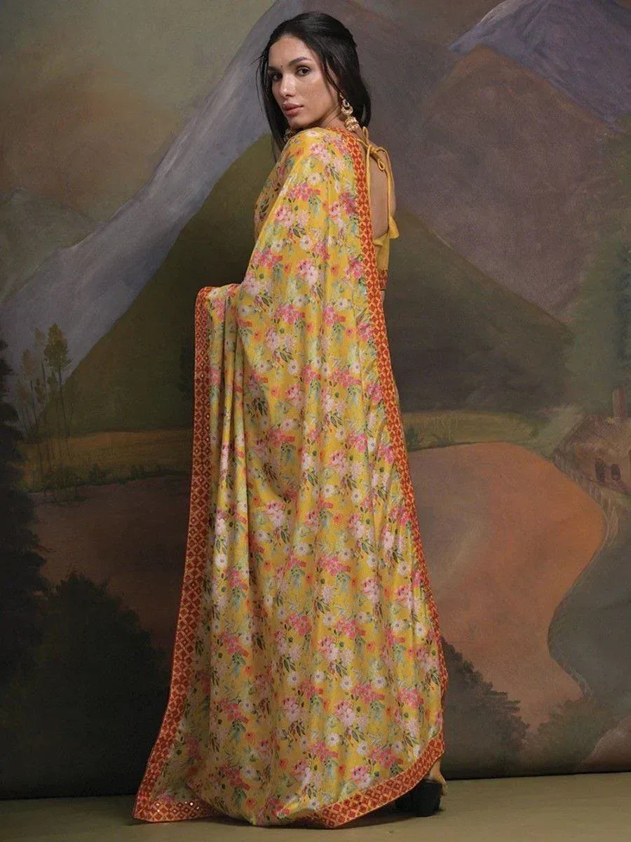 Yellow floral ethnic gown with red border, perfect for Indian occasions and festive wear