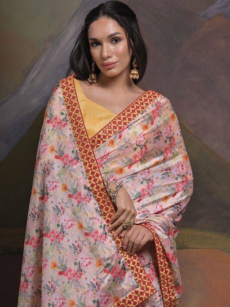 Floral printed saree with embroidered border, paired with yellow blouse, perfect for ethnic occasions