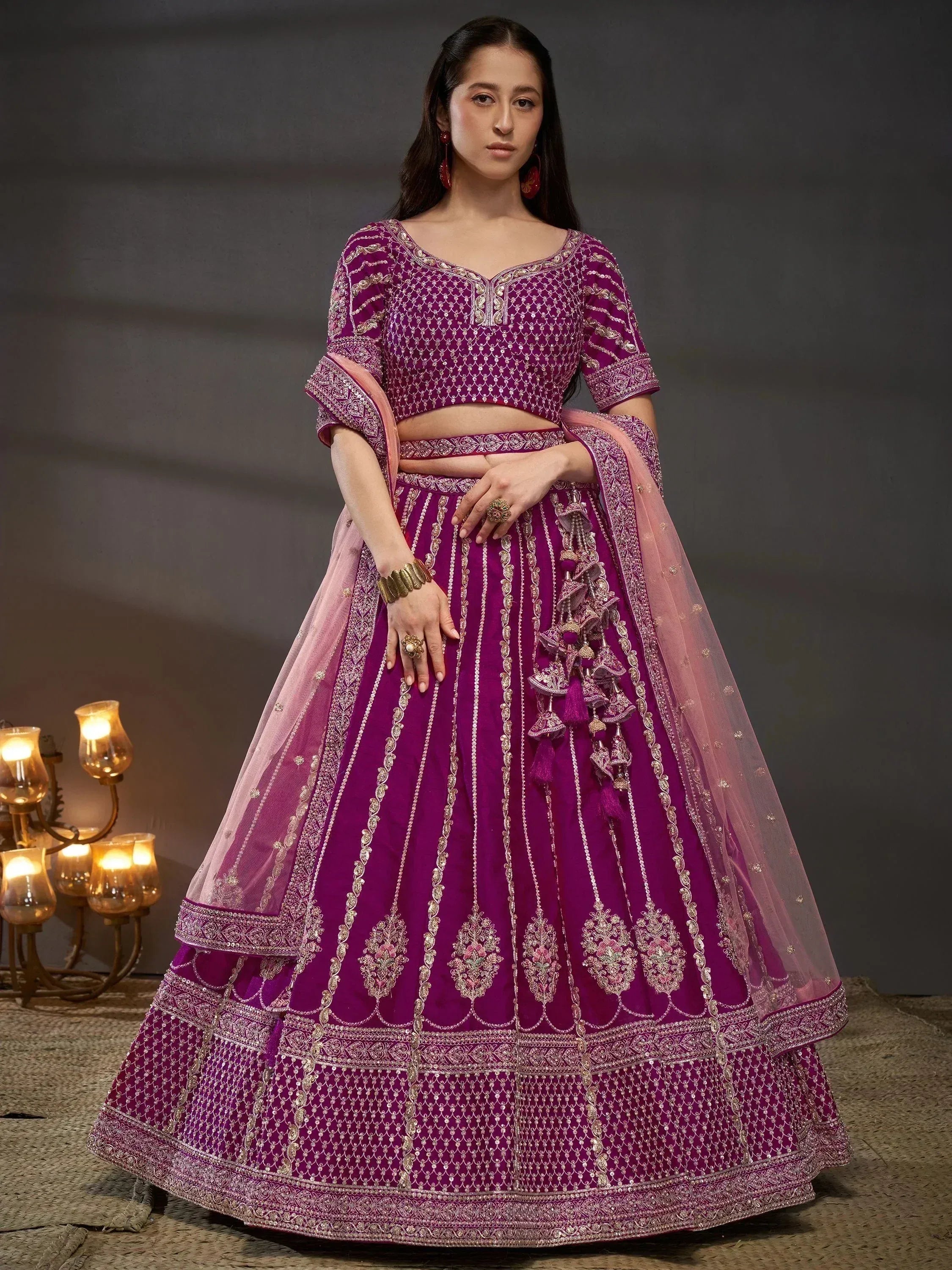 Elegant purple lehenga choli with gold embroidery, perfect for weddings and festive occasions.