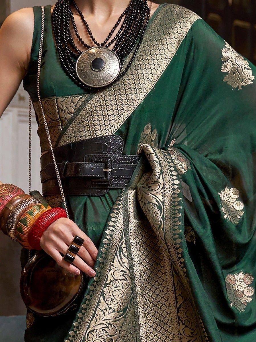 Emerald green saree with gold embroidery, styled with black belt and statement necklace for ethnic wear