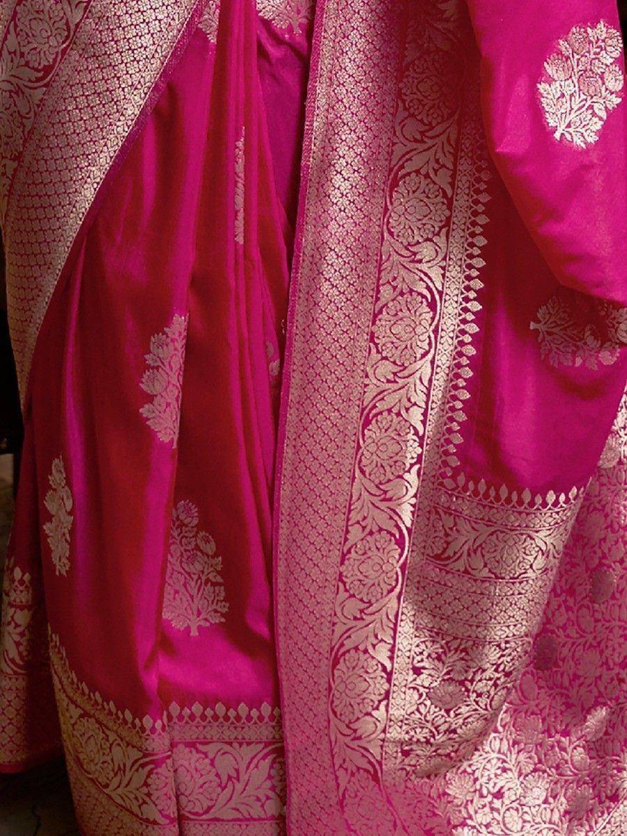 Pink silk saree with gold zari floral border and intricate woven motifs, ideal for Indian ethnic occasions