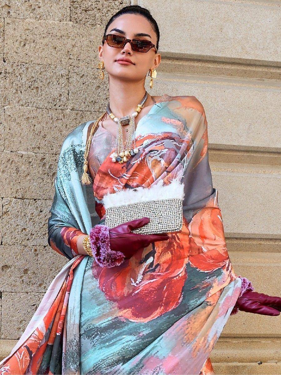Woman in floral printed ethnic gown with statement jewelry and gloves, styled for modern Indian fashion