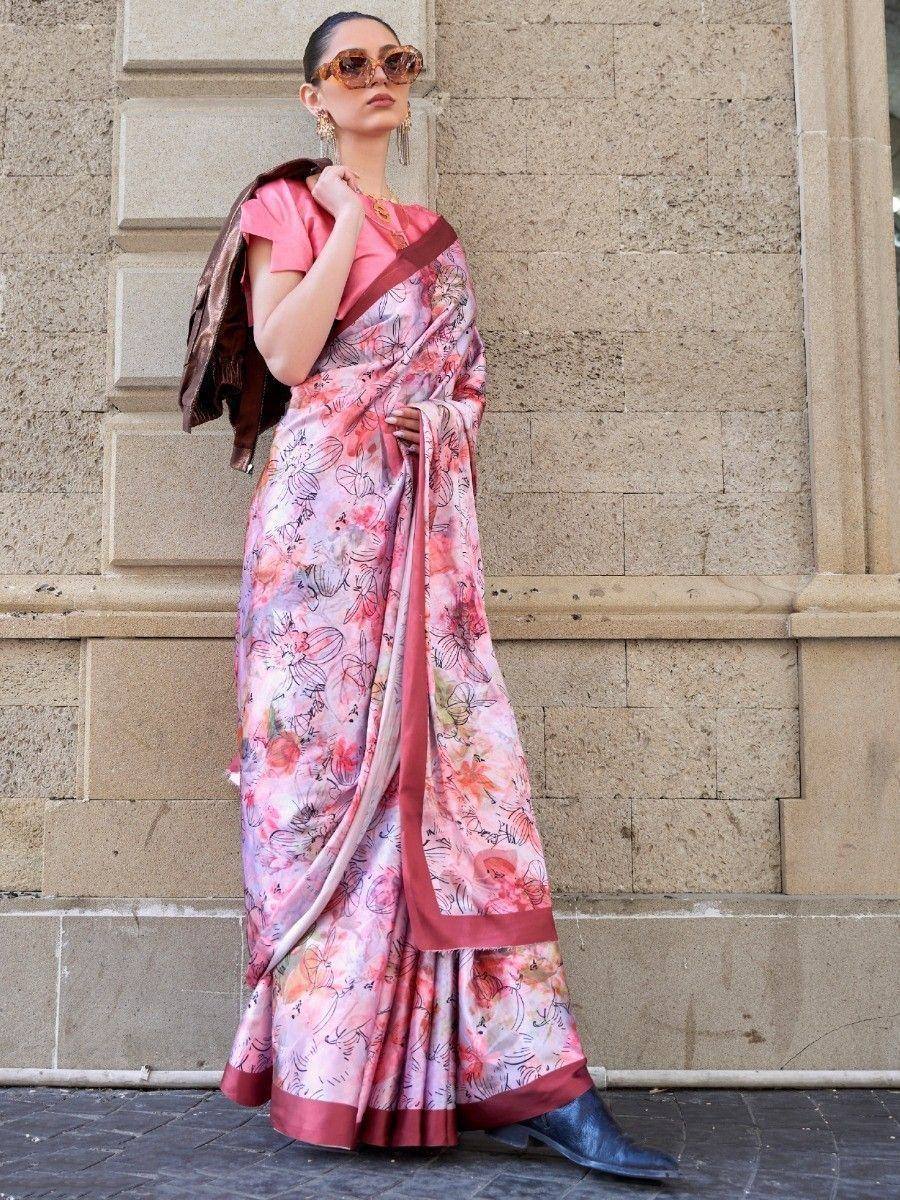 Woman in pink floral saree with modern blouse, styled with boots and sunglasses for ethnic fashion