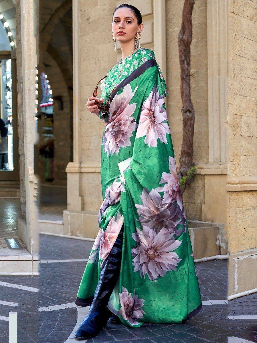 Green floral print saree with pink blossoms, styled with boots for modern ethnic wear