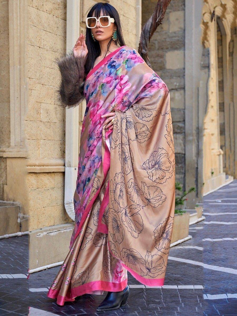 Woman in floral print saree with pink border, stylish ethnic wear for women