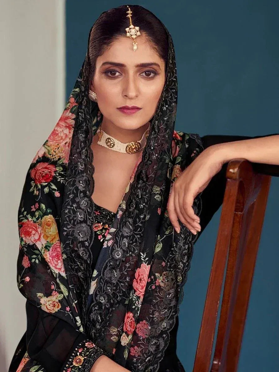 Black floral ethnic salwar kameez with lace dupatta and traditional jewelry