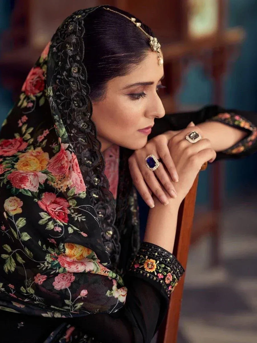 Woman in black floral ethnic wear with embroidered dupatta and statement jewelry