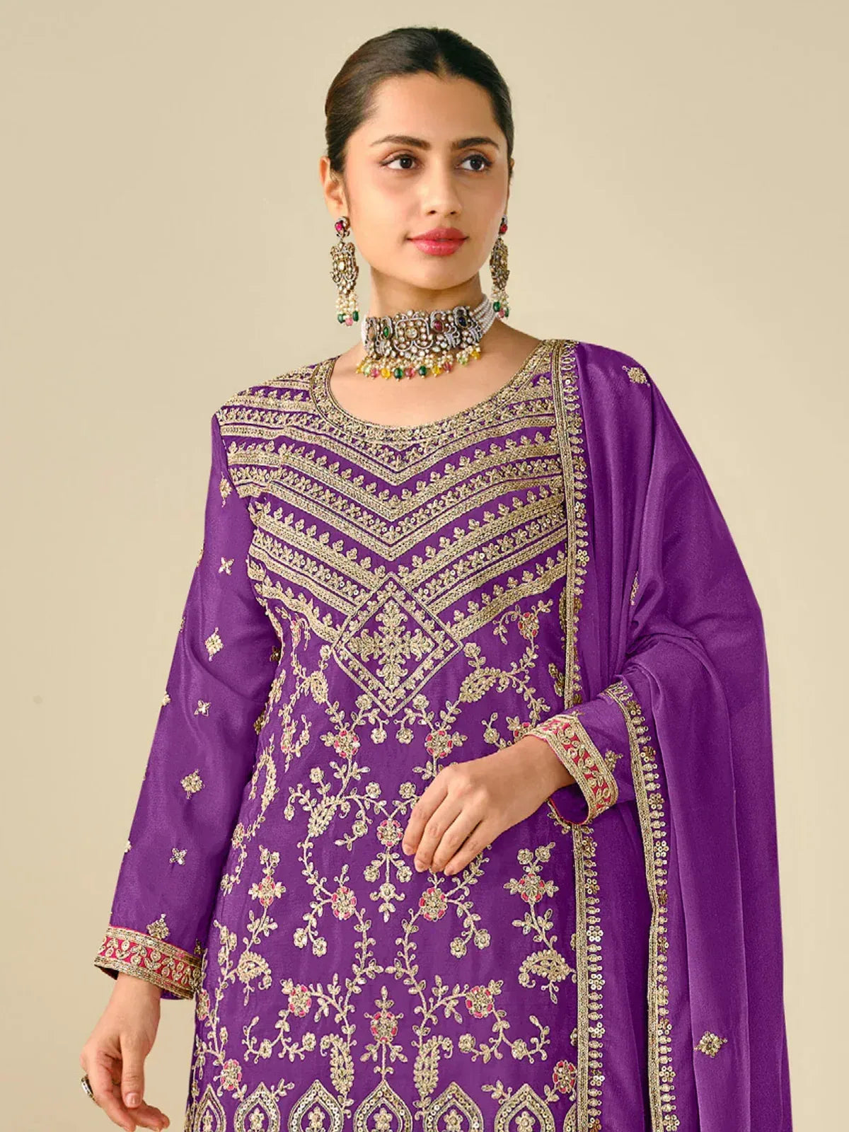Purple embroidered salwar kameez with gold detailing, floral motifs, and matching dupatta for Indian ethnic wear