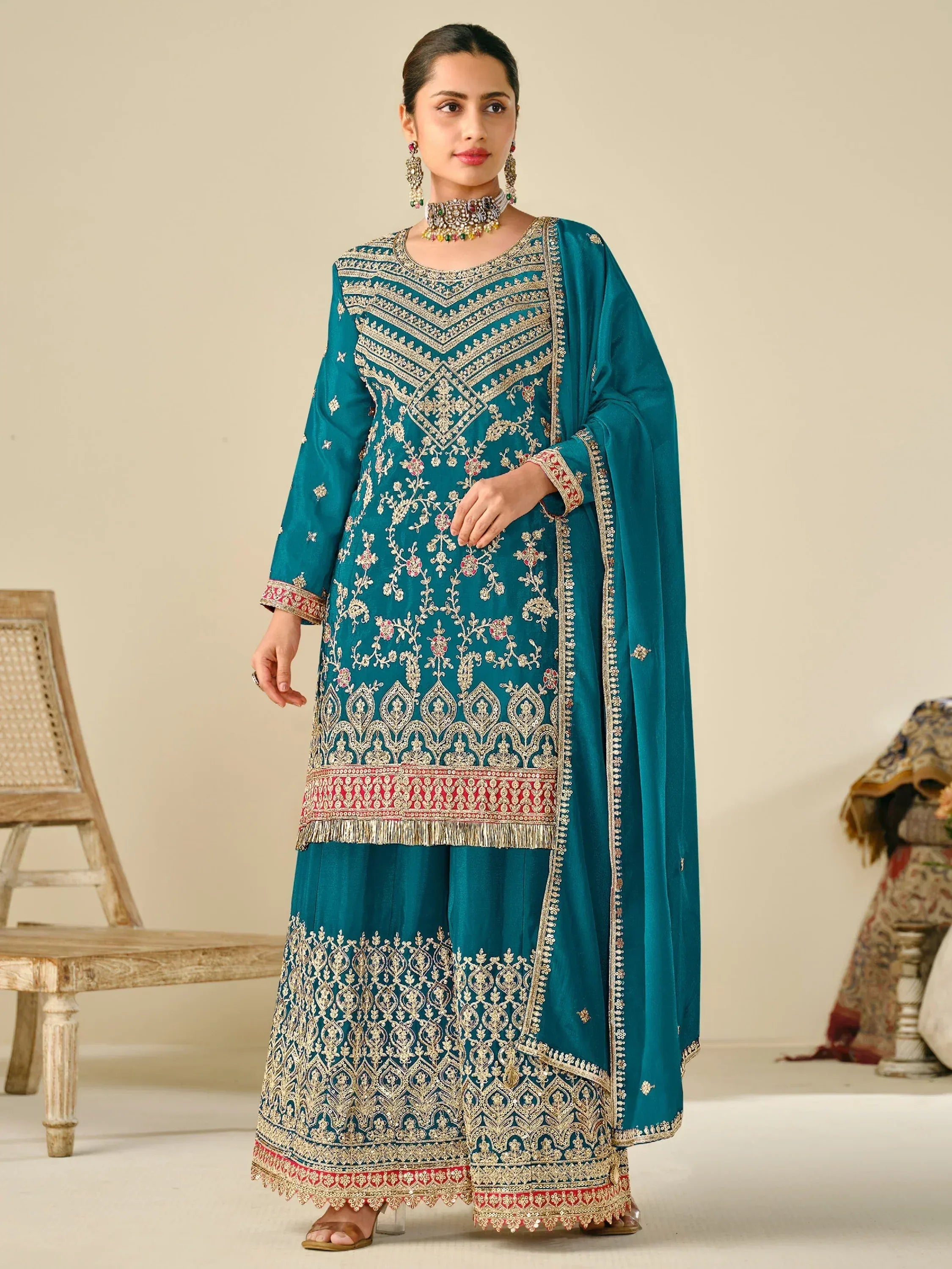 Teal embroidered salwar kameez with gold detailing, perfect for Indian ethnic wear occasions