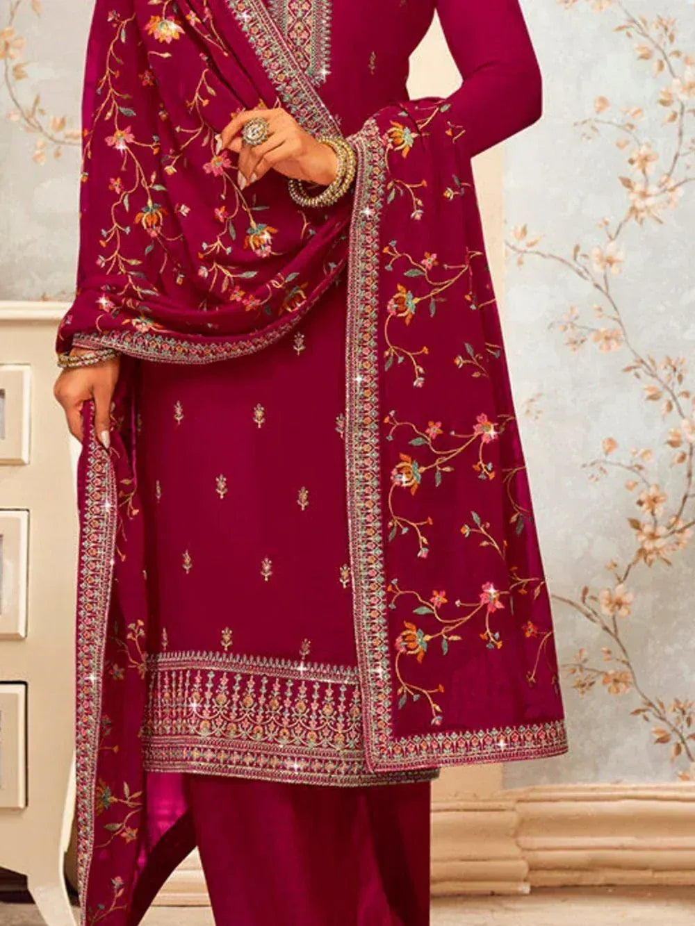 Maroon embroidered salwar kameez with floral dupatta and detailed ethnic patterns